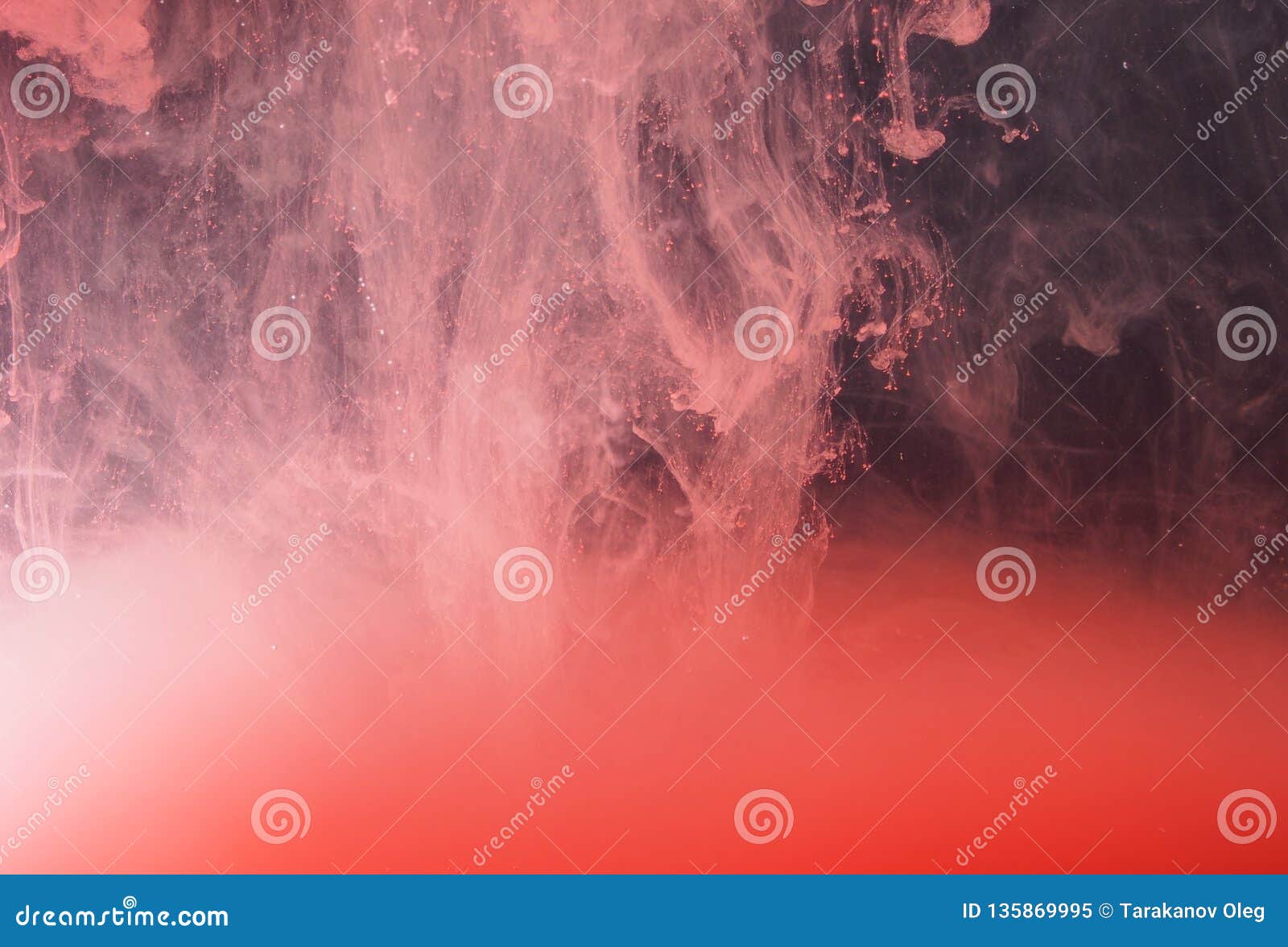 A Drop of Paint Dissolves in Water. Red Paint is Mixed with Water Stock