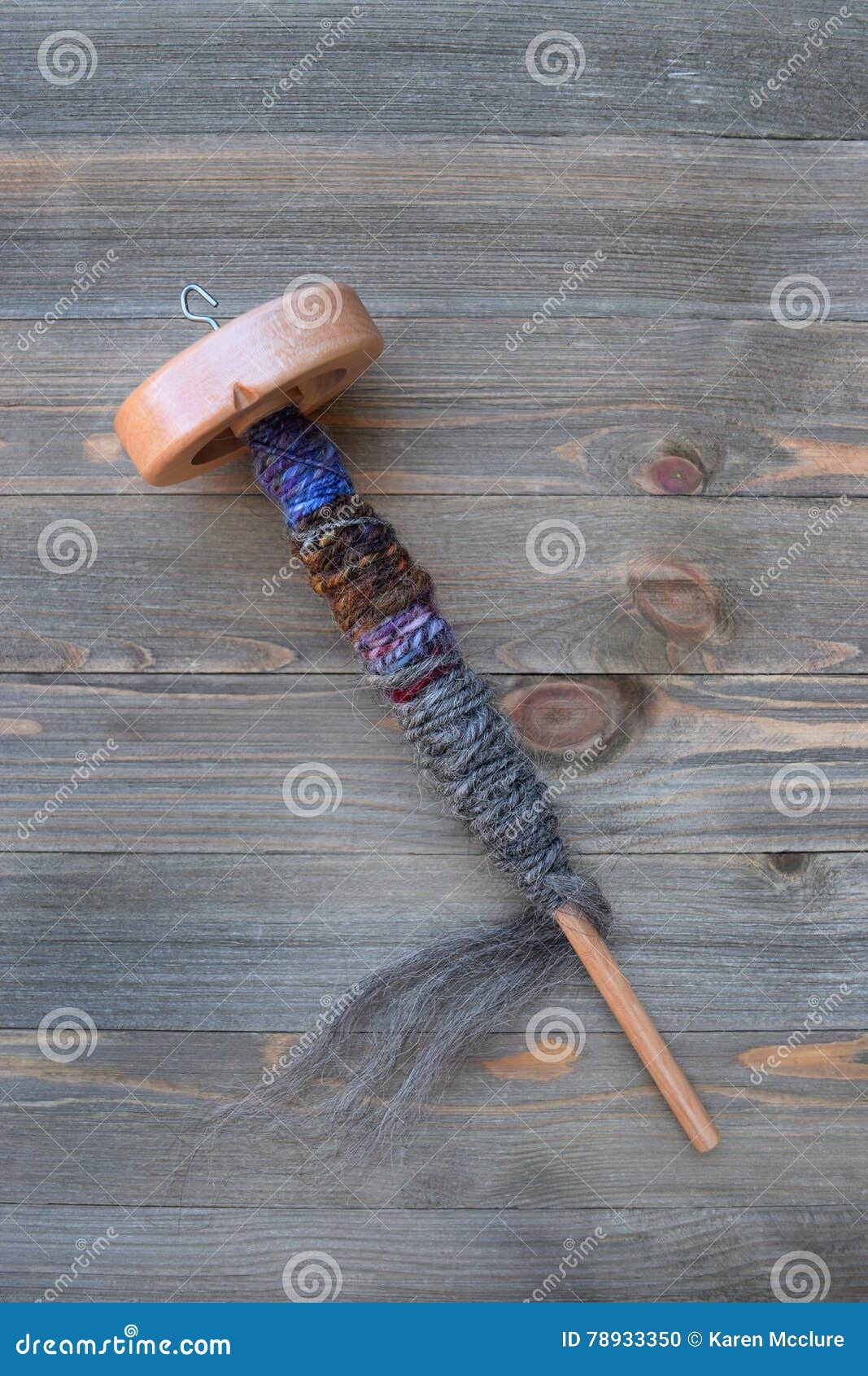 Drop Spindle For Spinning Sheep Wool Into Yarn Stock Photo 