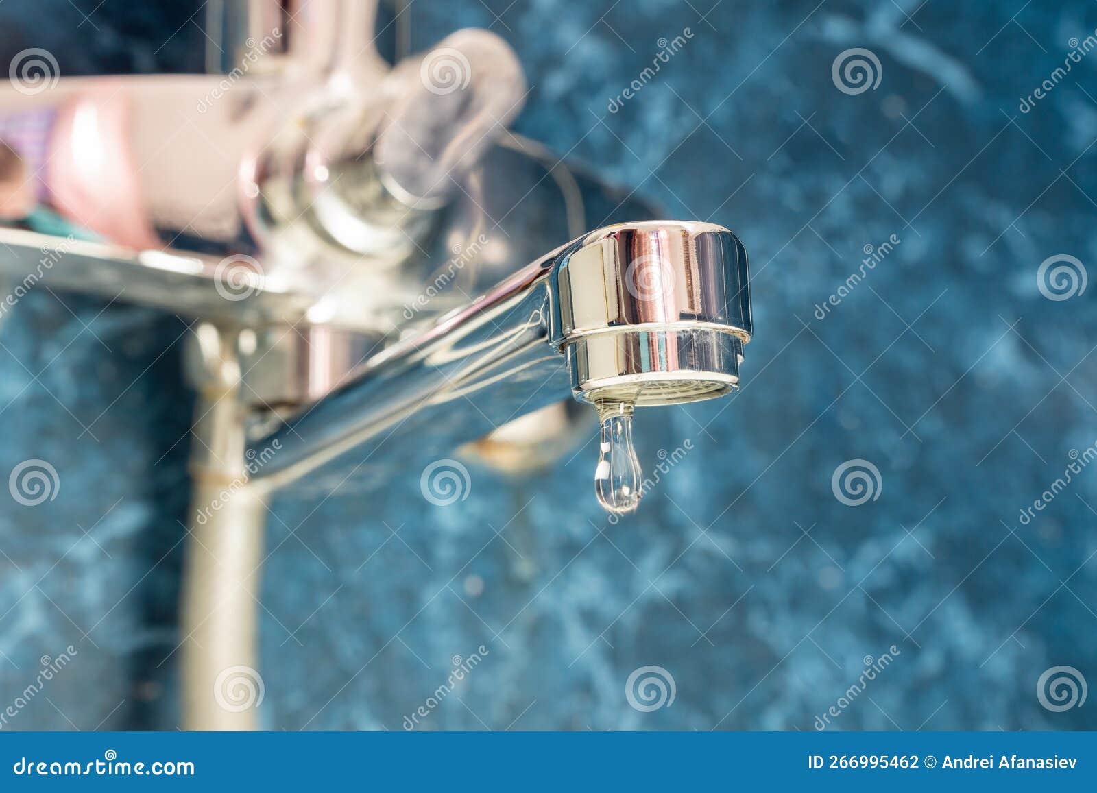 A Drop of Water Drips from a Leaky Faucet Stock Photo Image of