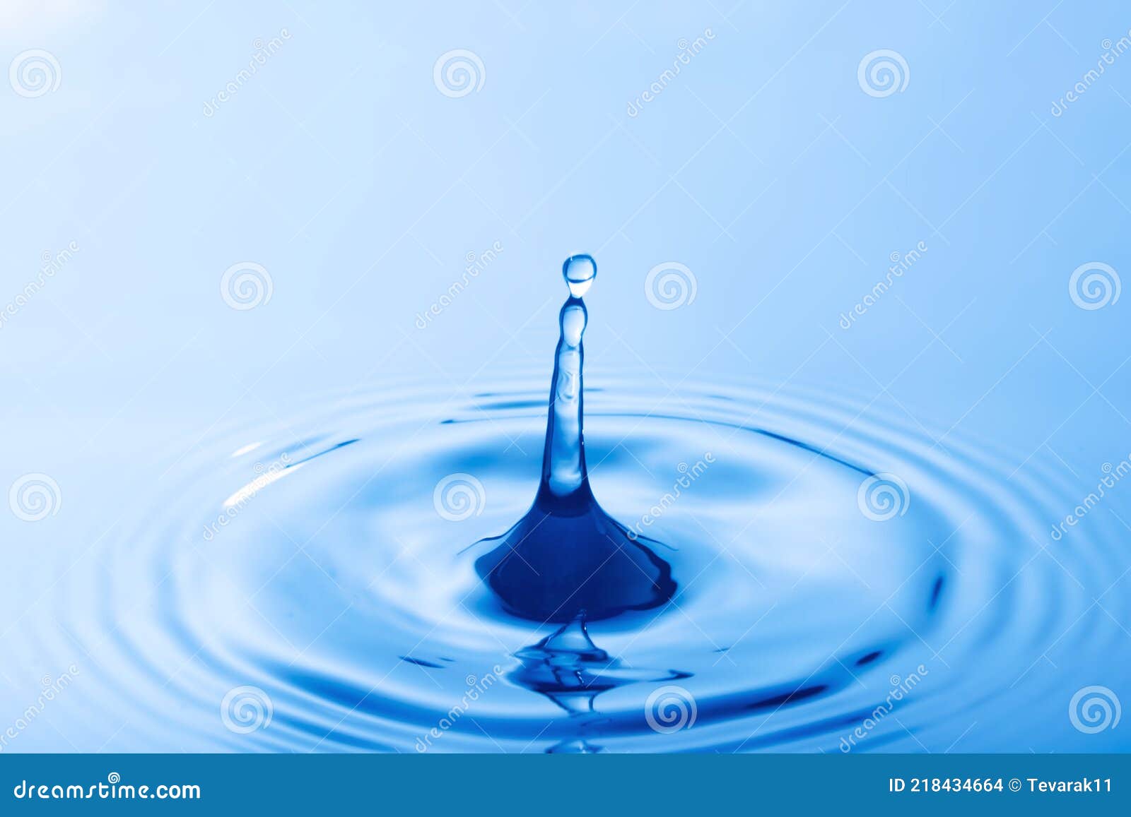 Drop of Water. Water Droplet Falling Impact with Water Surface Stock