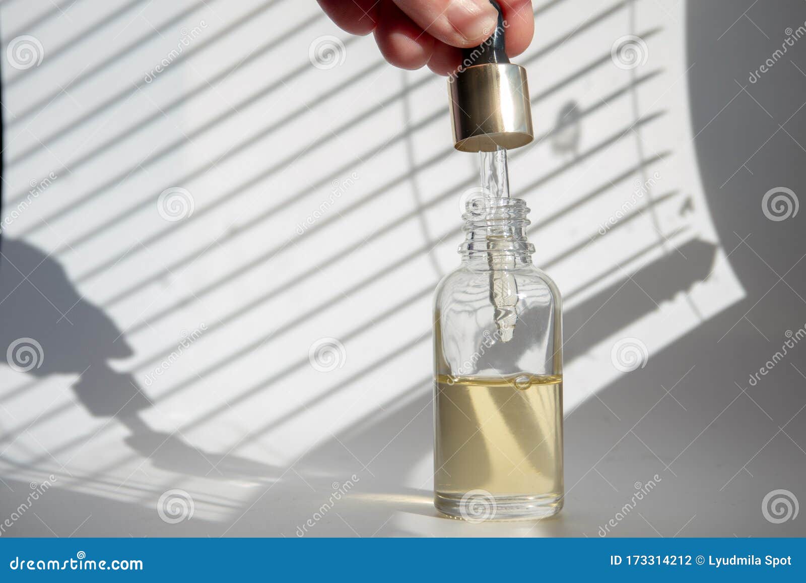 Download Dropper Glass Bottle With Pipette. Mock Up Essential Liquid On A Blue Background Stock Photo ...
