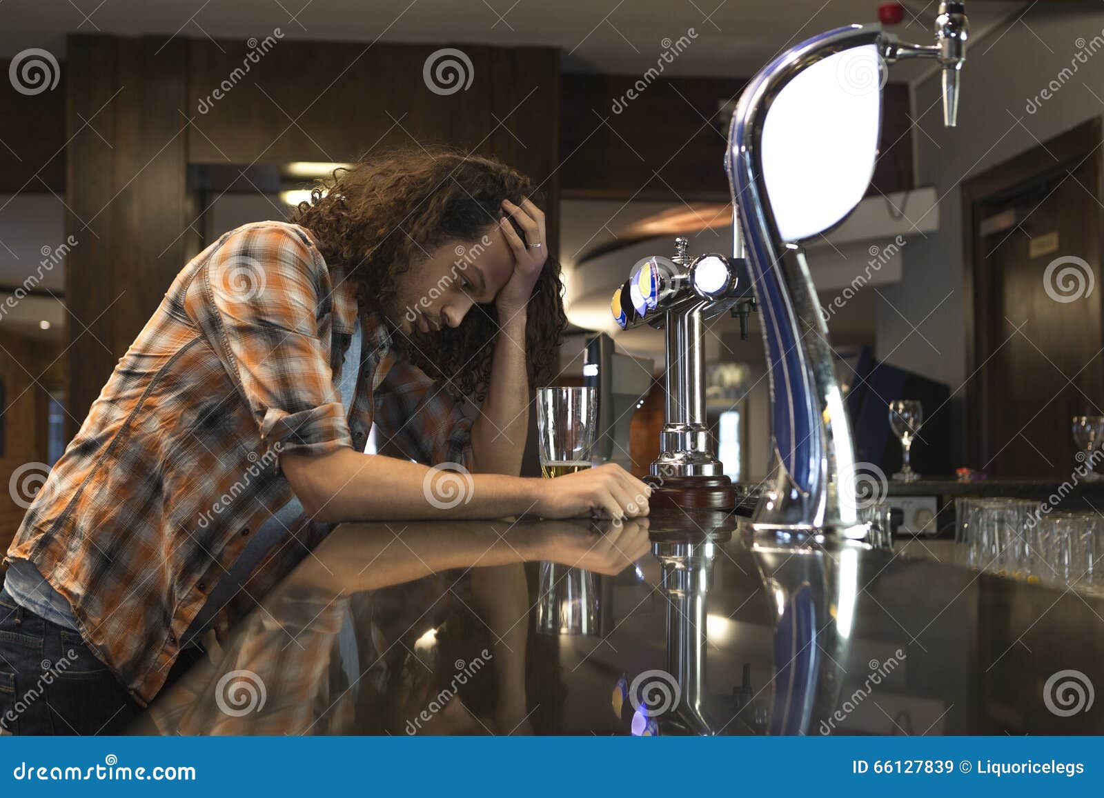 Image result for man drowning his sorrows in beer