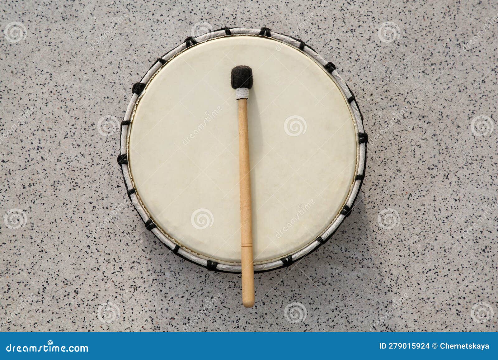 Drum and Drumstick on Grey Table, Top View. Percussion Musical