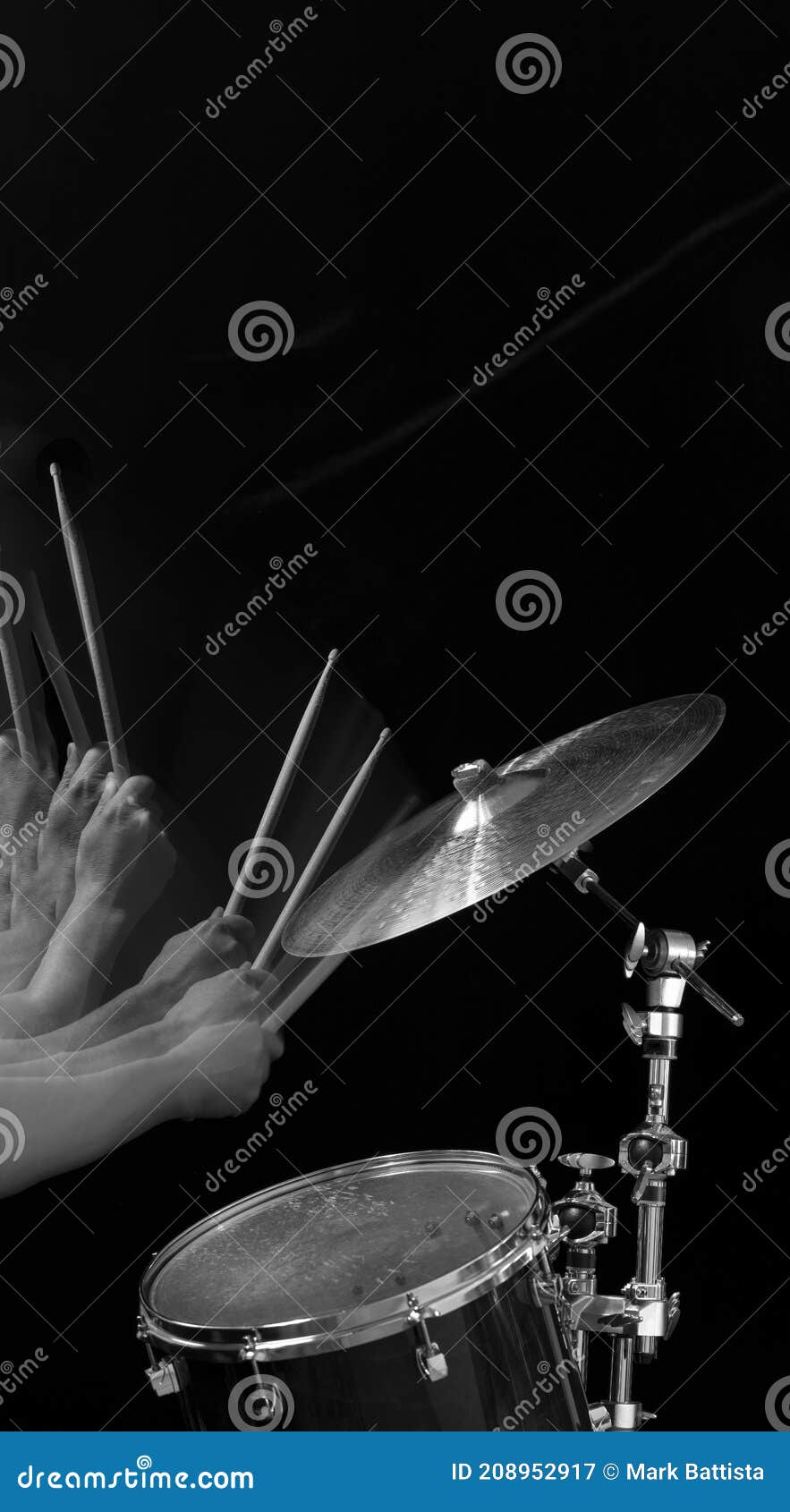 A Drummer Hitting a Cymbal with Drum Sticks in Motion Stock Image
