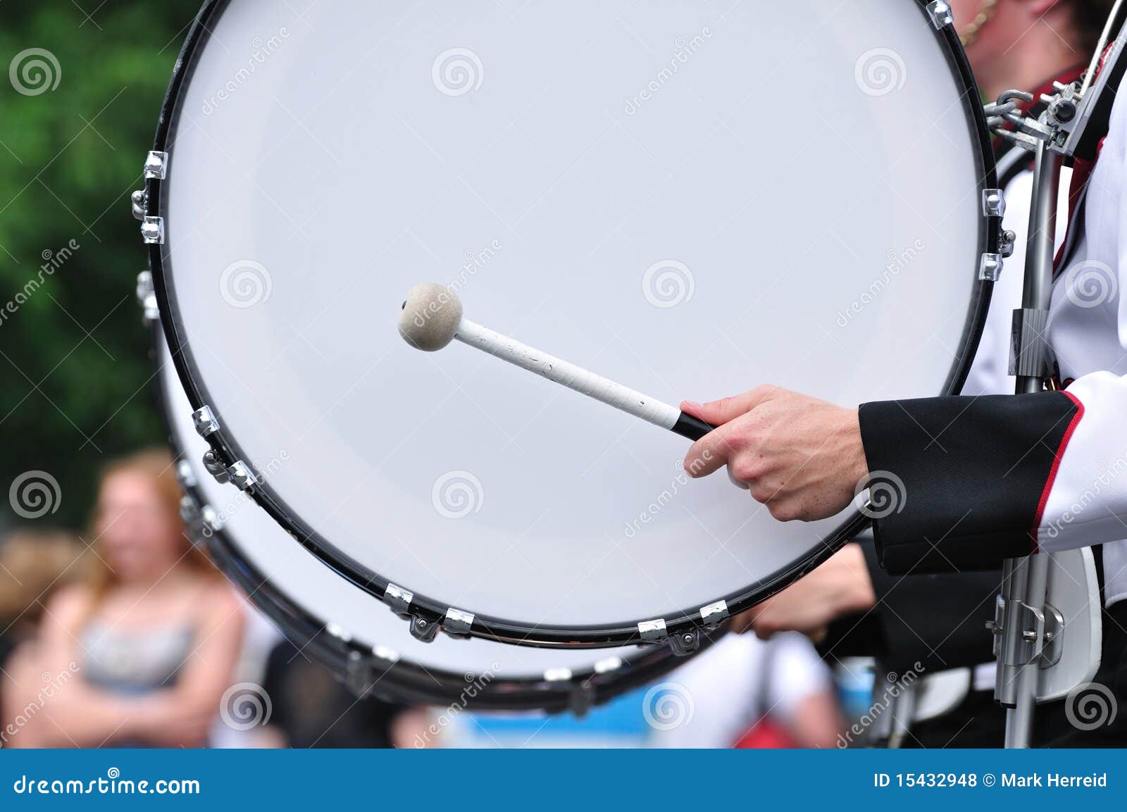 drummer playing bass drum in parade