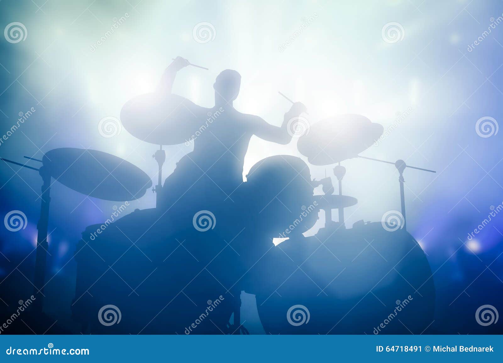 drummer playing on drums on music concert. club lights