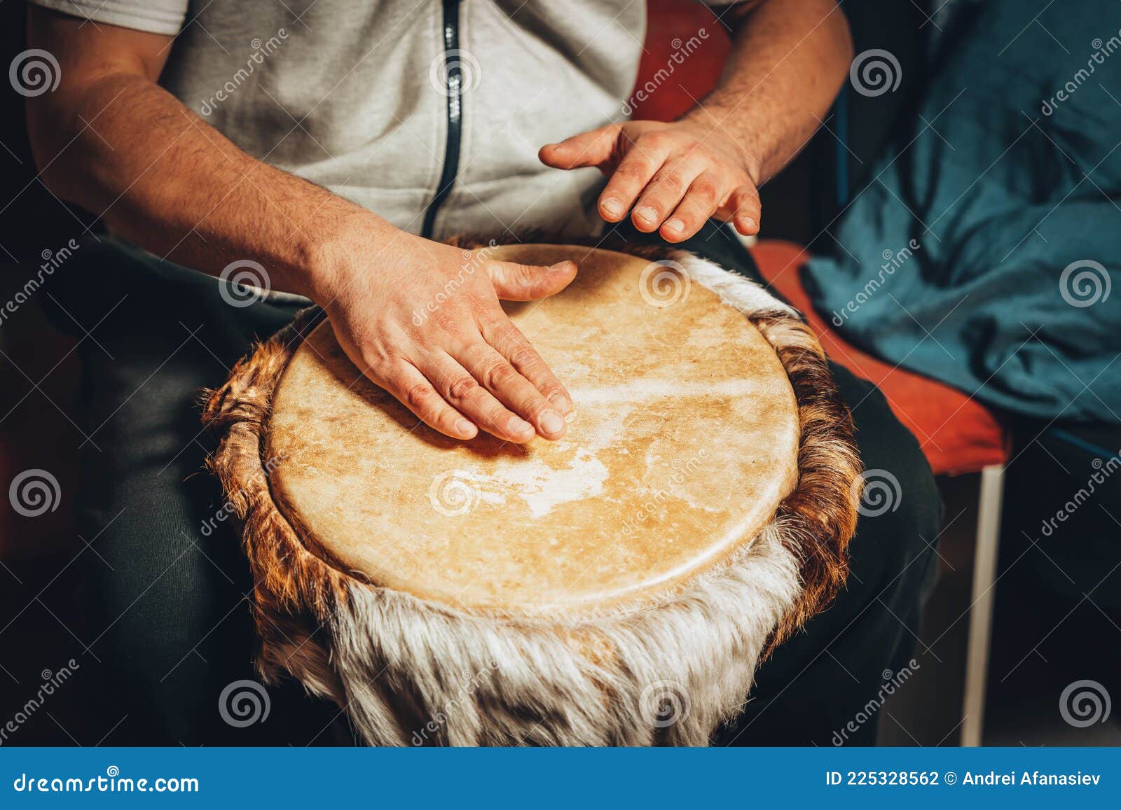 The Drummer Plays the Ethnic Percussion Musical Instrument Djembe Stock