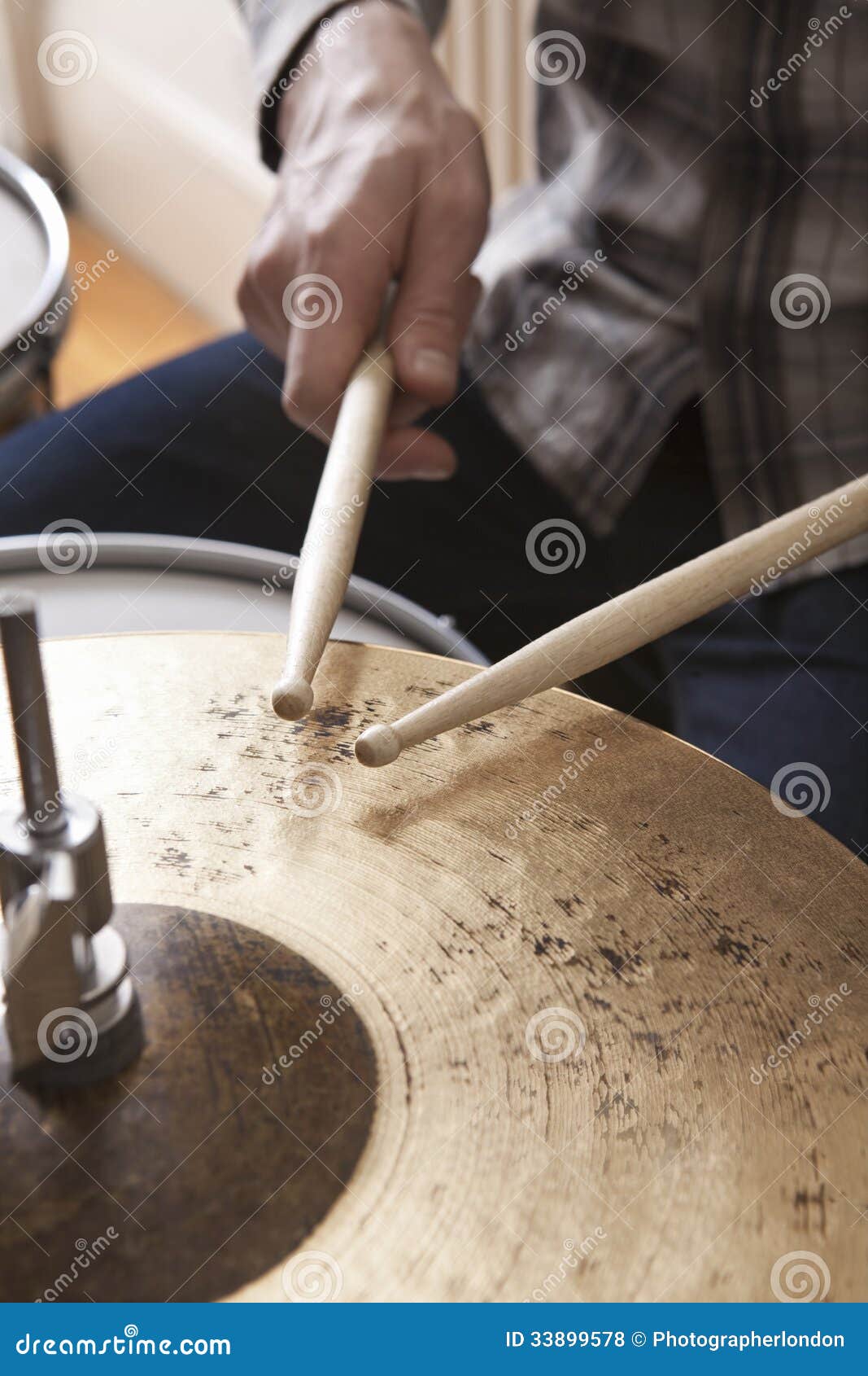 drumsticks on metal cymbal