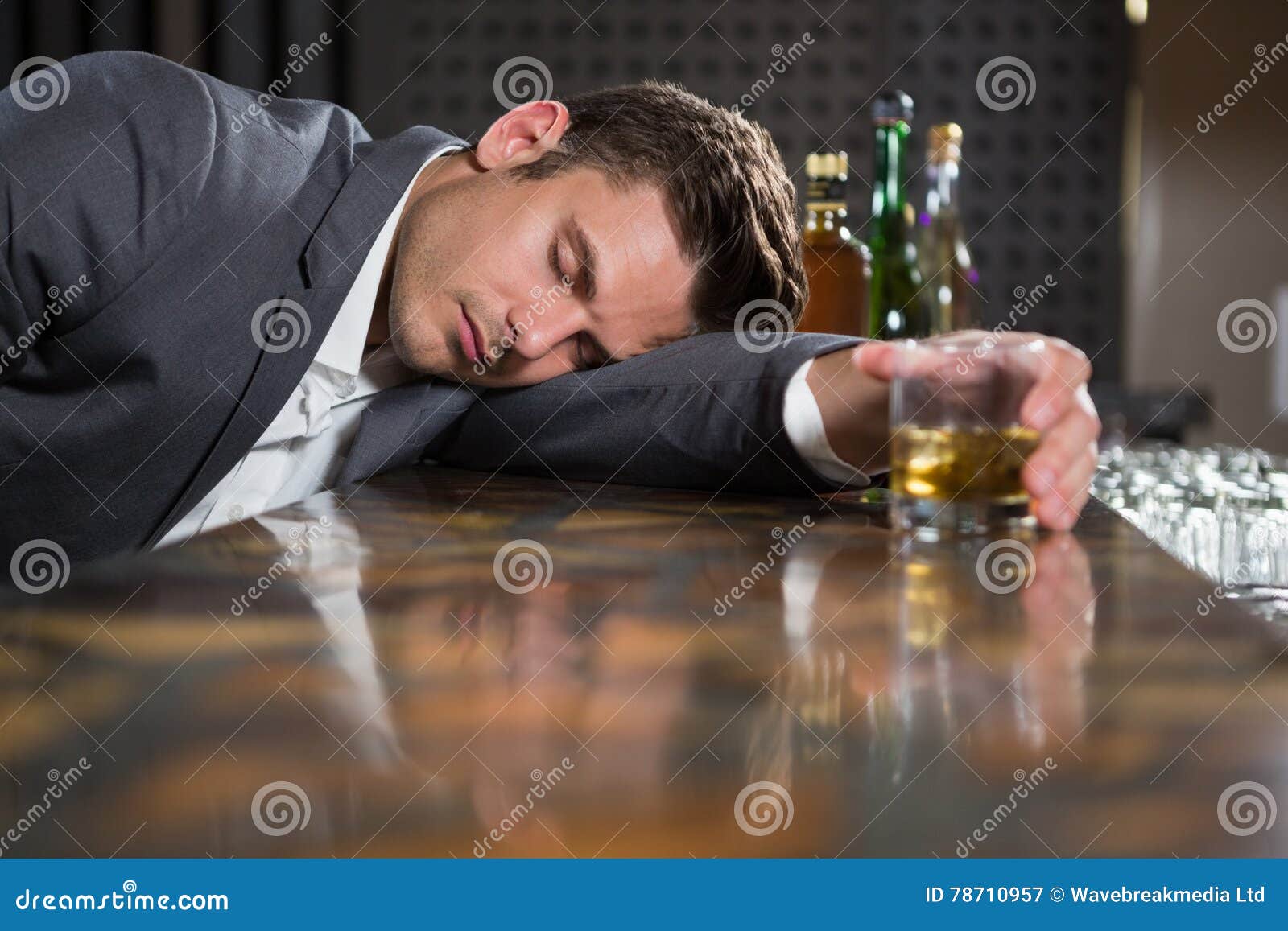 Drunk Man Lying on a Counter with Glass of Whisky Stock Image - Image ...