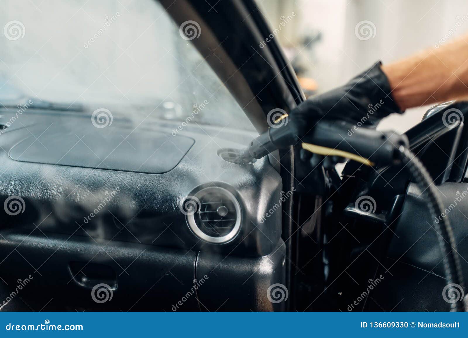 Carwash, Worker Cleans Salon with Steam Cleaner Stock Image