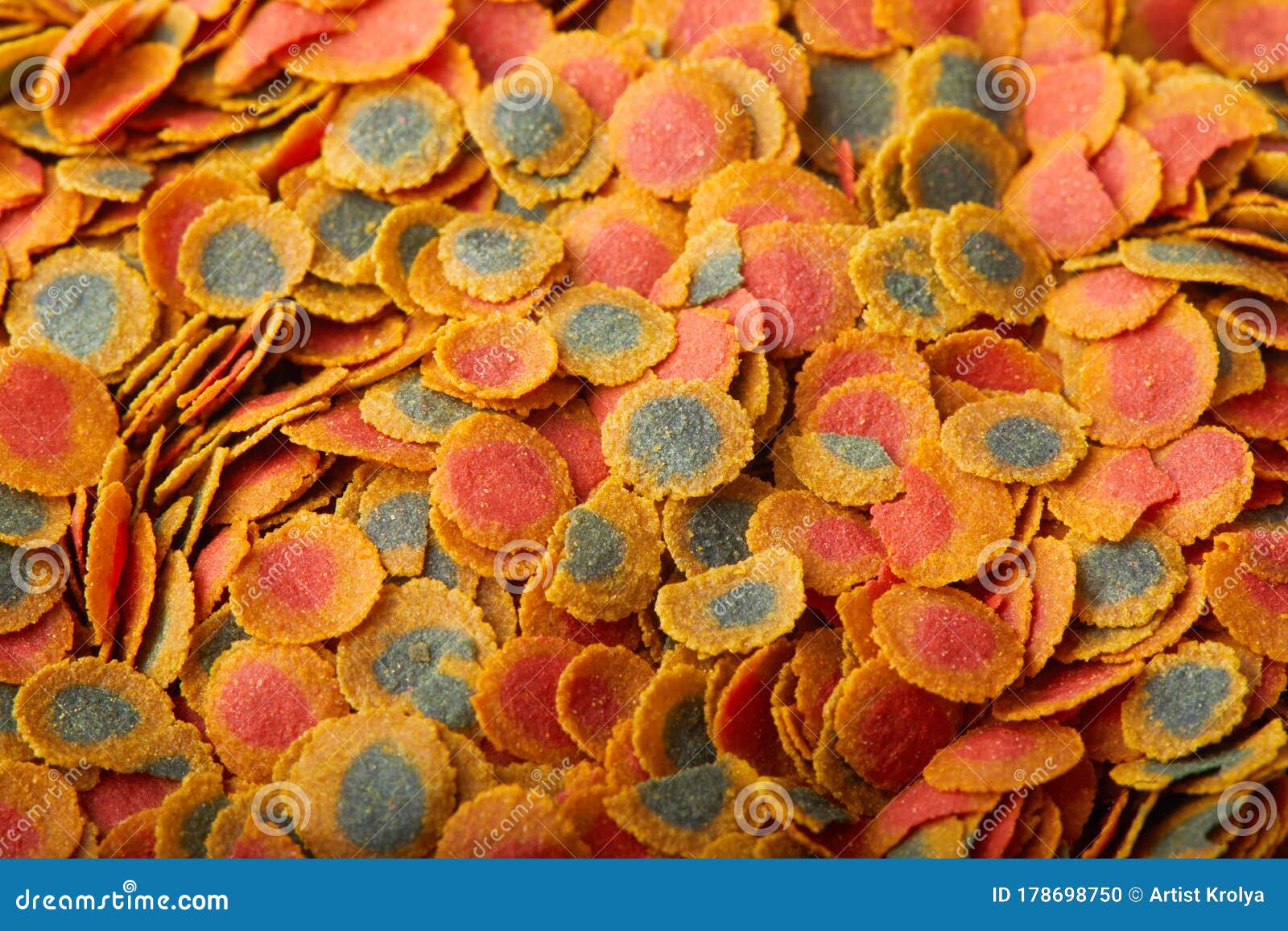 Dry Compound Fish Feed Flake Crisps Background. Stock Photo Image of