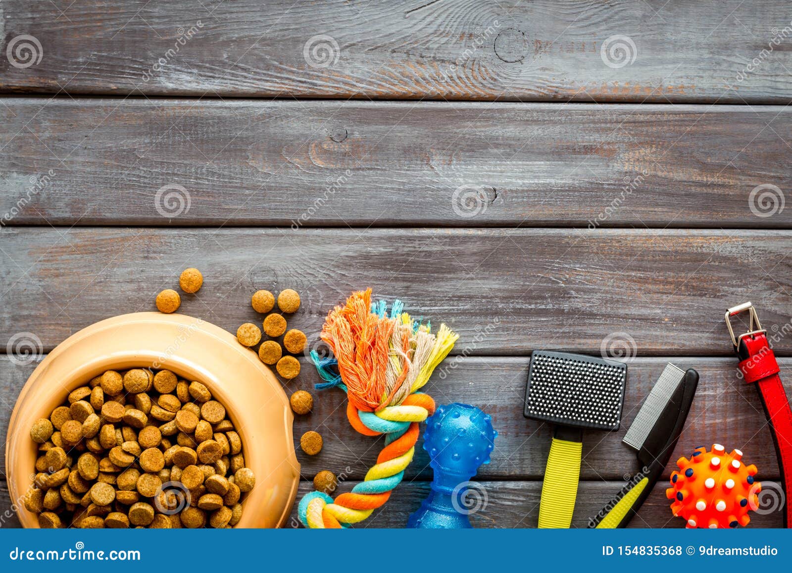 Download Dry Dog Food In Bowl And Toys On Wooden Background Top View Mock-up Stock Photo - Image of ...