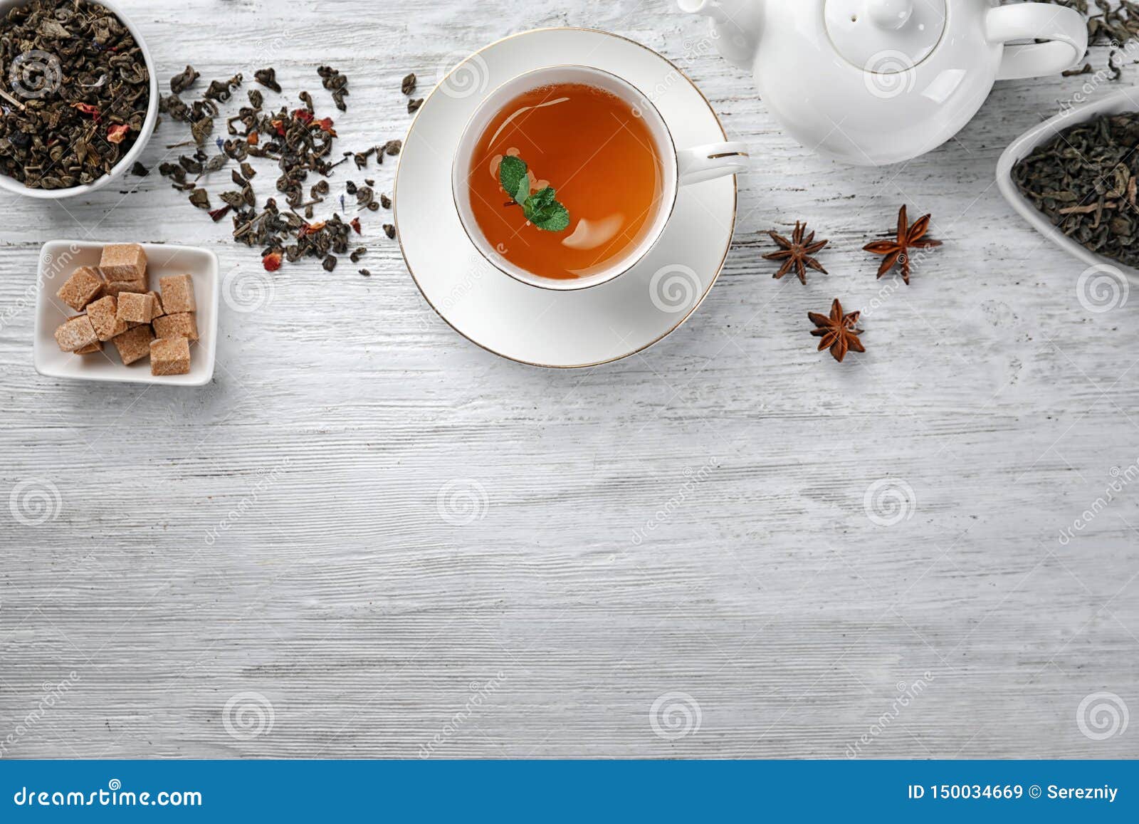 Dry Green Tea Leaves and Cup of Aromatic Beverage on Table Stock Image