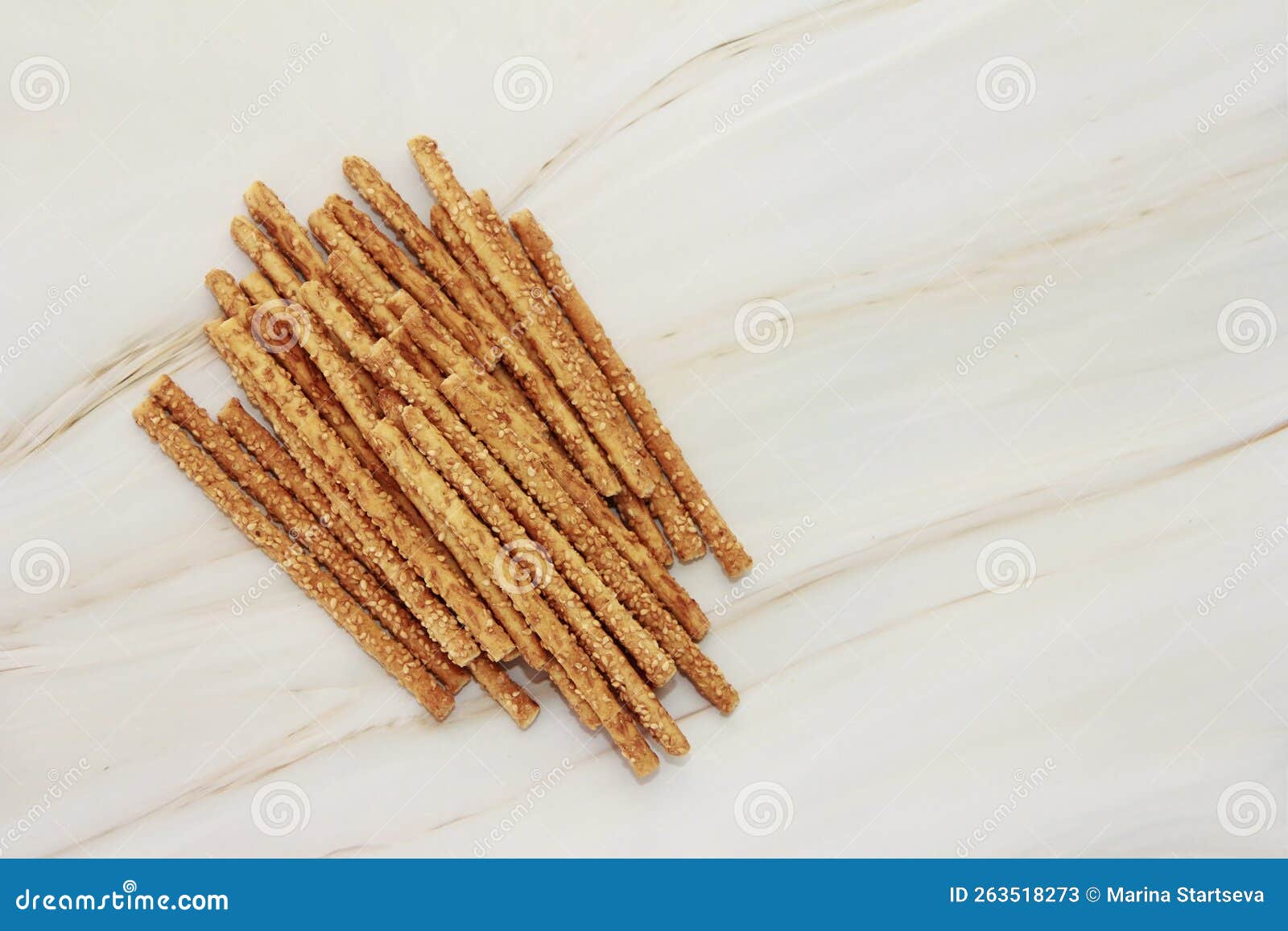 Dry Long Bread Sesame Sticks on a Gray Marble Background Editorial