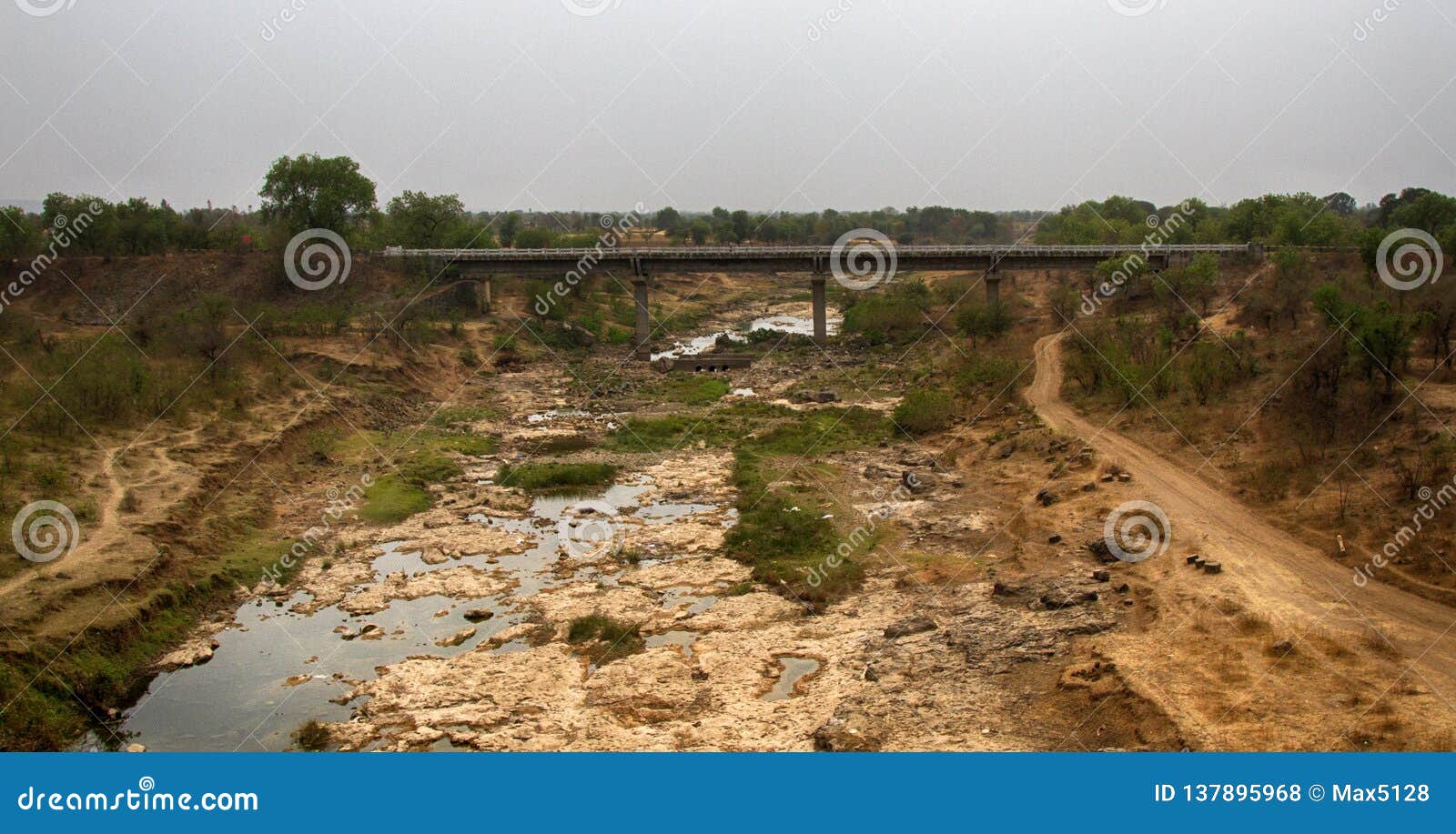Dry River Bed with a Bridge Stock Photo Image of dryness, levels