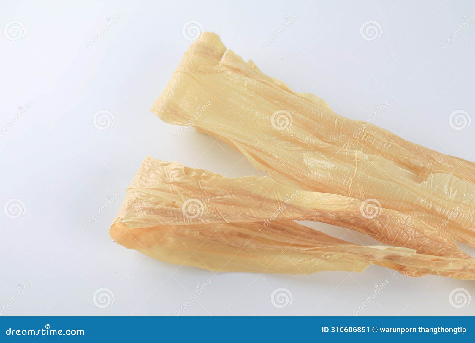 Dry Tofu Skin on White Background. Traditional Asian Meat Substitute