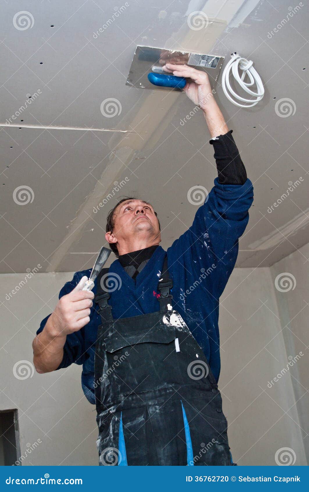 Dry waller making ceiling stock photo. Image of hardworking 36762720