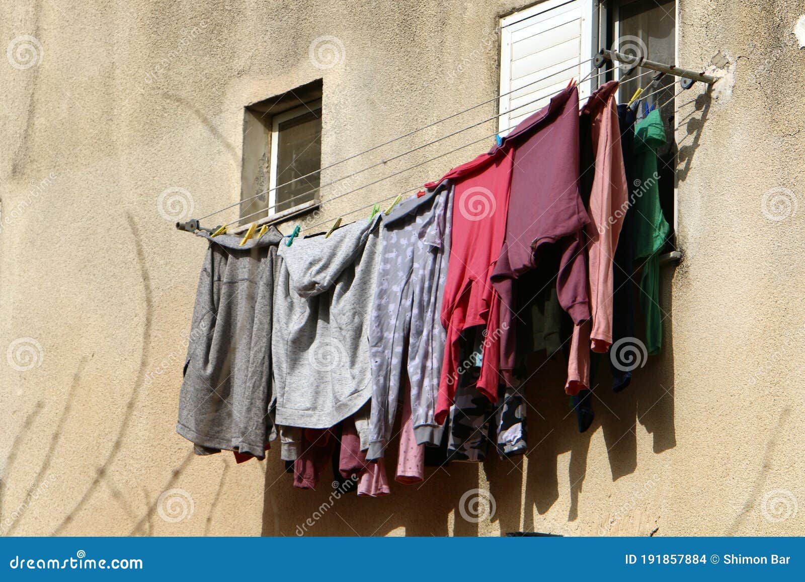 Drying Clothes on a Rope on Windows and Balconies Stock Photo - Image ...