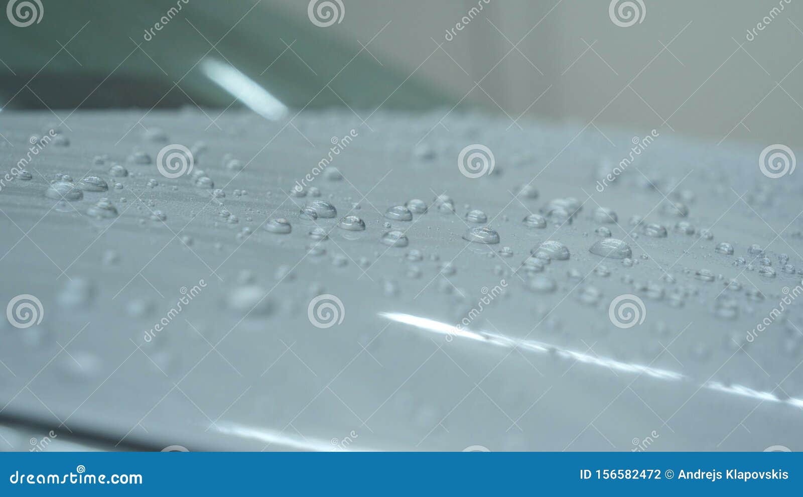 Drying of Windows after Car Washing, Drops Flow Down. Concept Drying