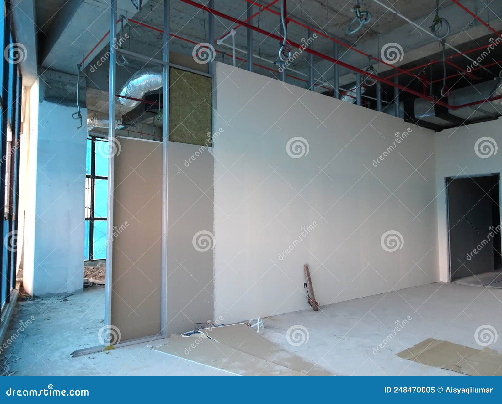 Drywall Installation Work in Progress by Construction Workers at the