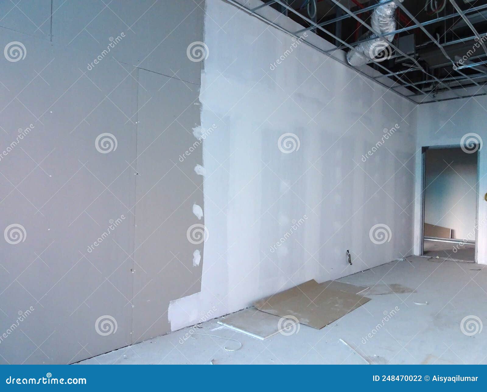 Drywall Installation Work in Progress by Construction Workers at the