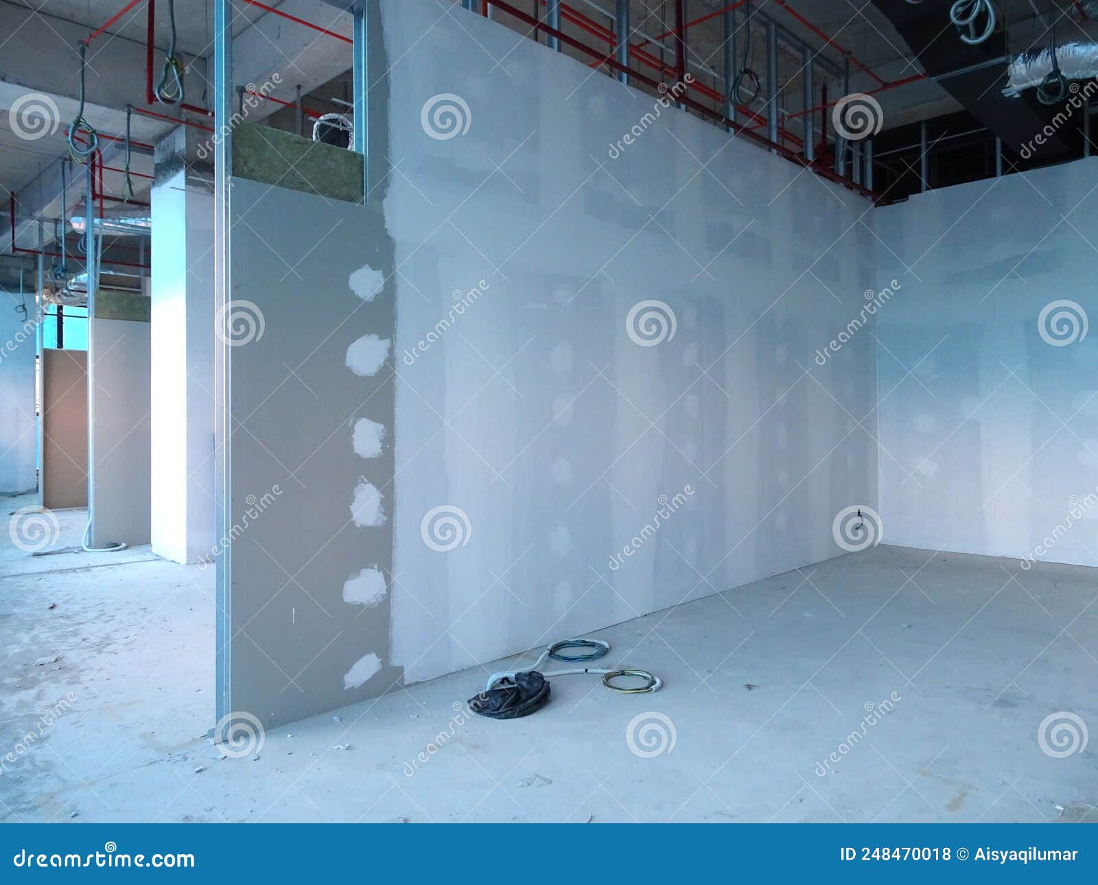 Drywall Installation Work in Progress by Construction Workers at the Construction Site