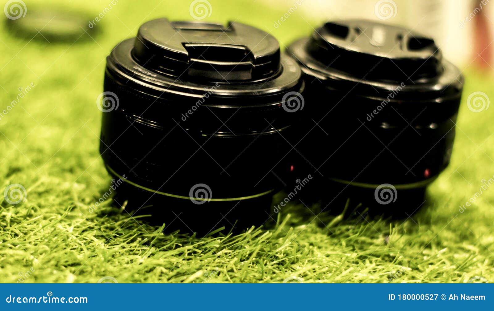 dslr prime lens on grassy background .selective focus blurry background
