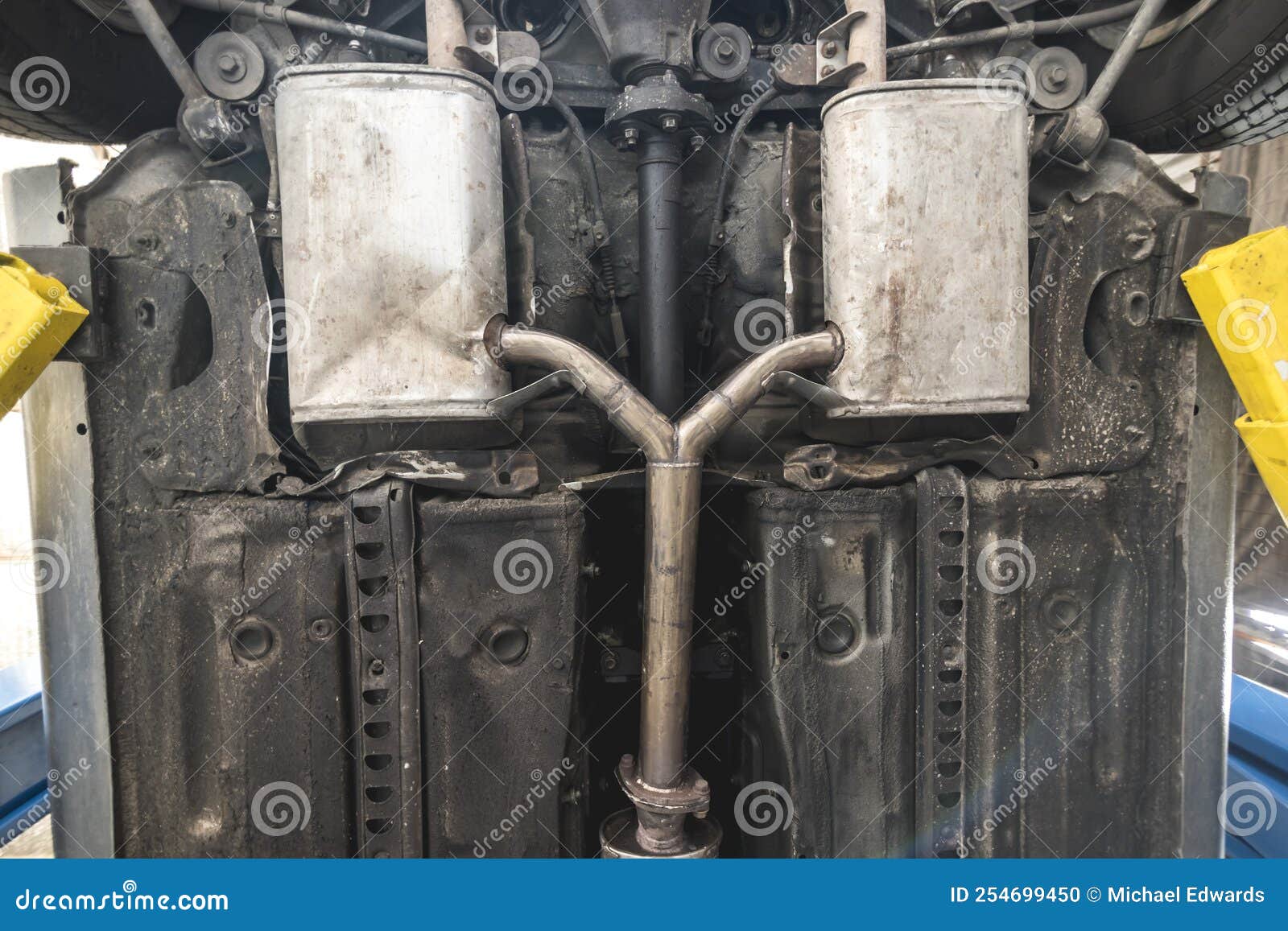 A Dual Exhaust Muffler System Installed Underneath the Chassis of a