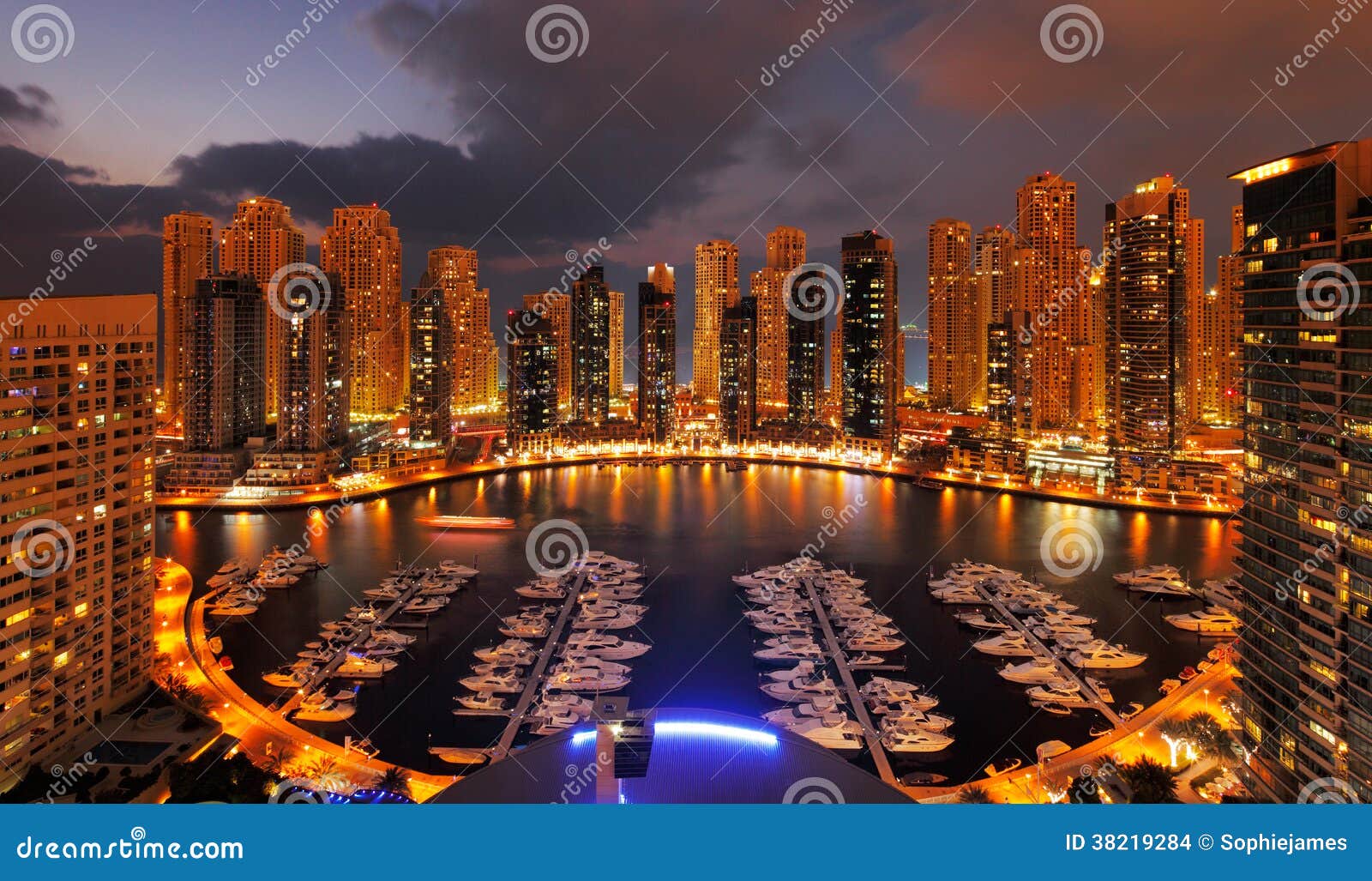 dubai marina at dusk showing numerous skyscrapers of jlt