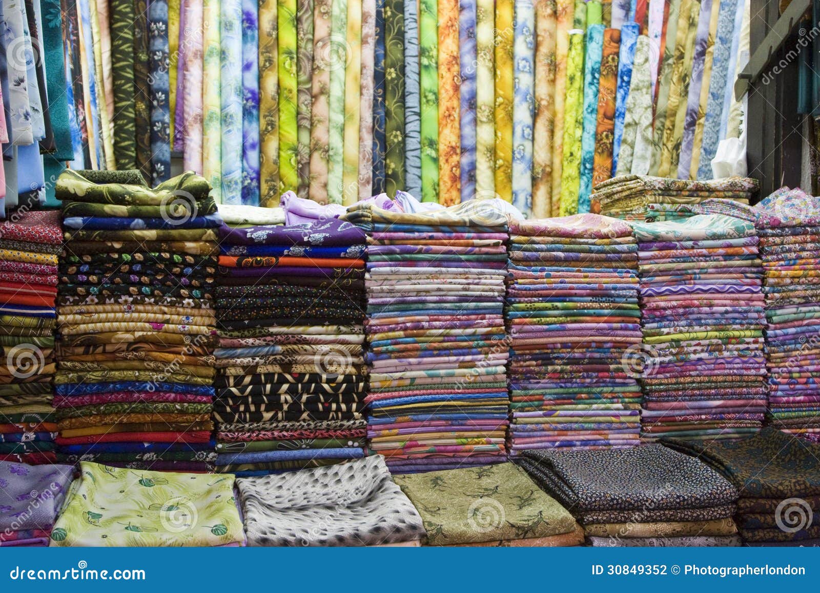 dubai uae colorful fabrics are displayed for sale at the al naif souq in deira.
