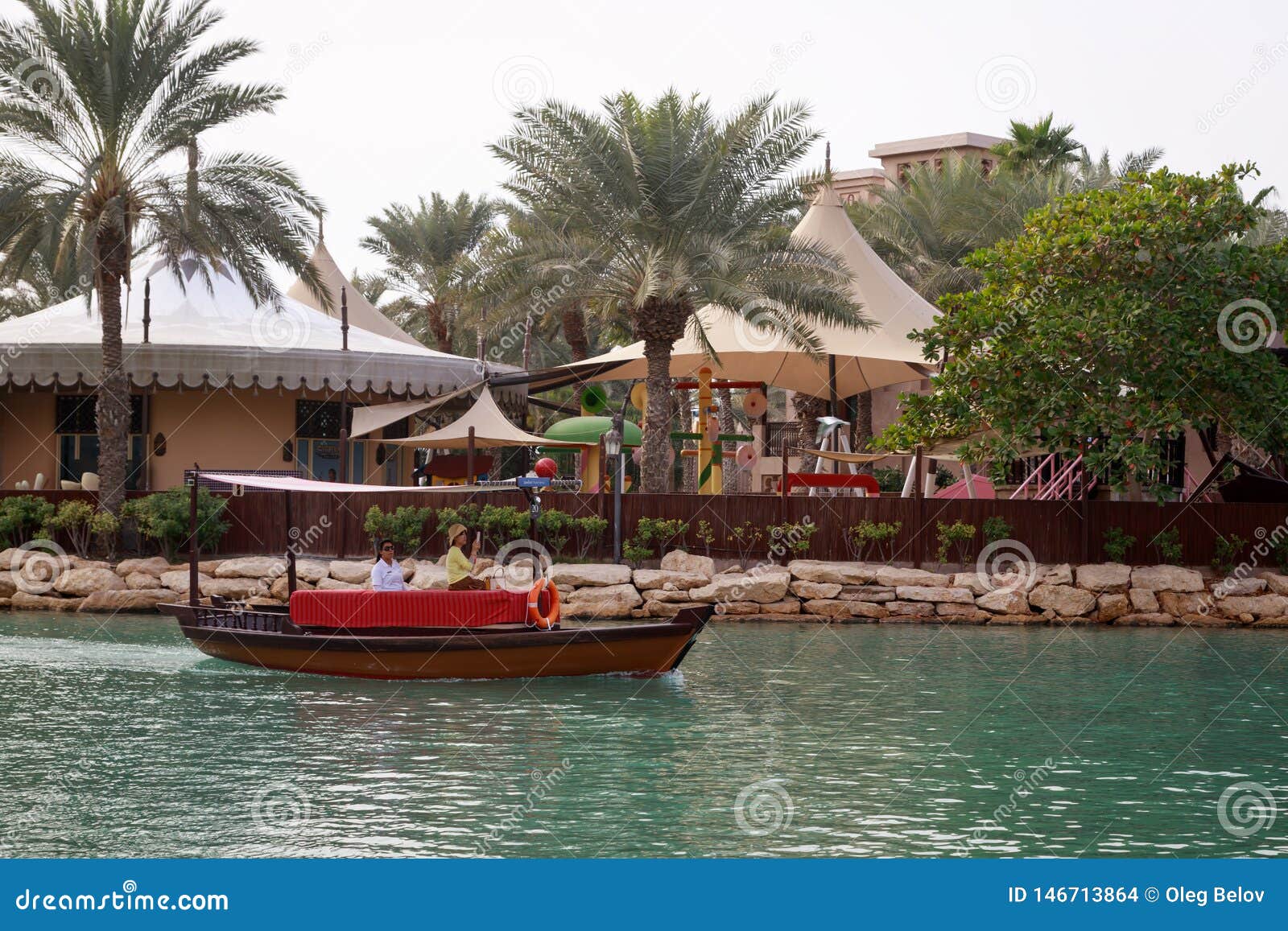 Traditional Wooden Arabic Boat With Tourists Sails On 