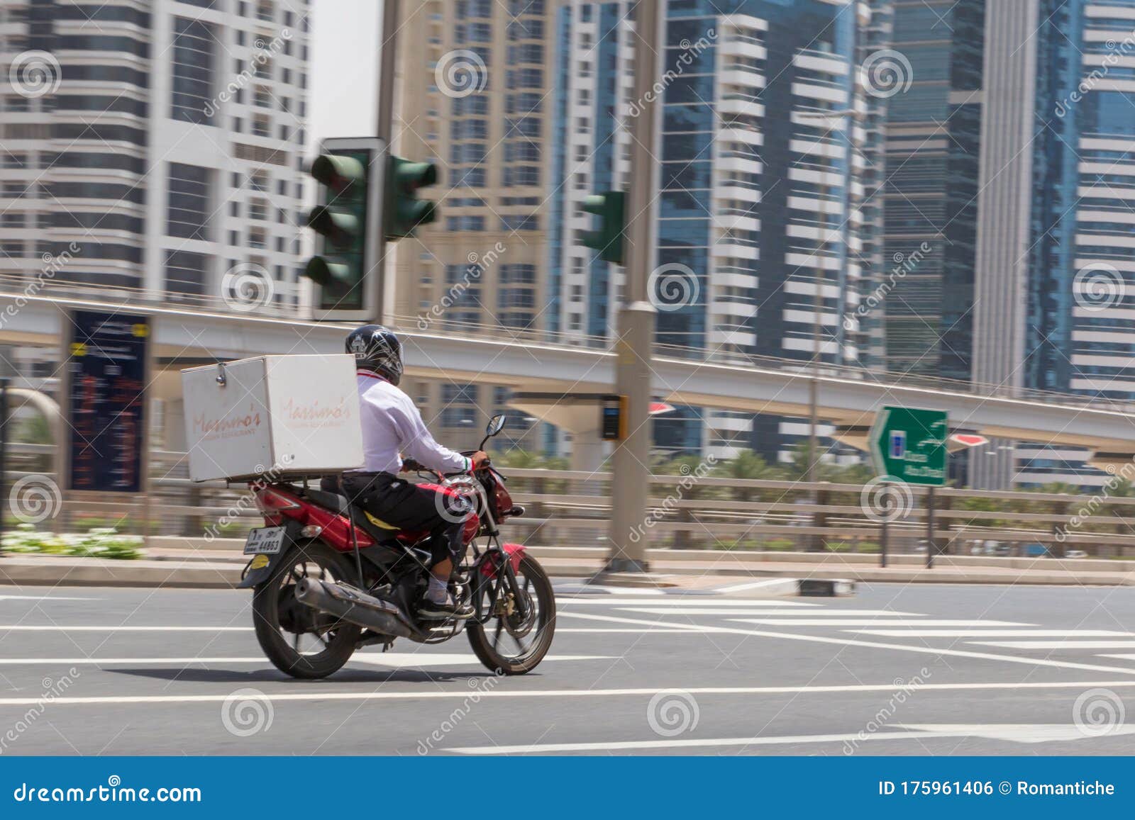 DUBAI, UAE MAY 12, 2016 Motorcycle Food Delivery Service Editorial