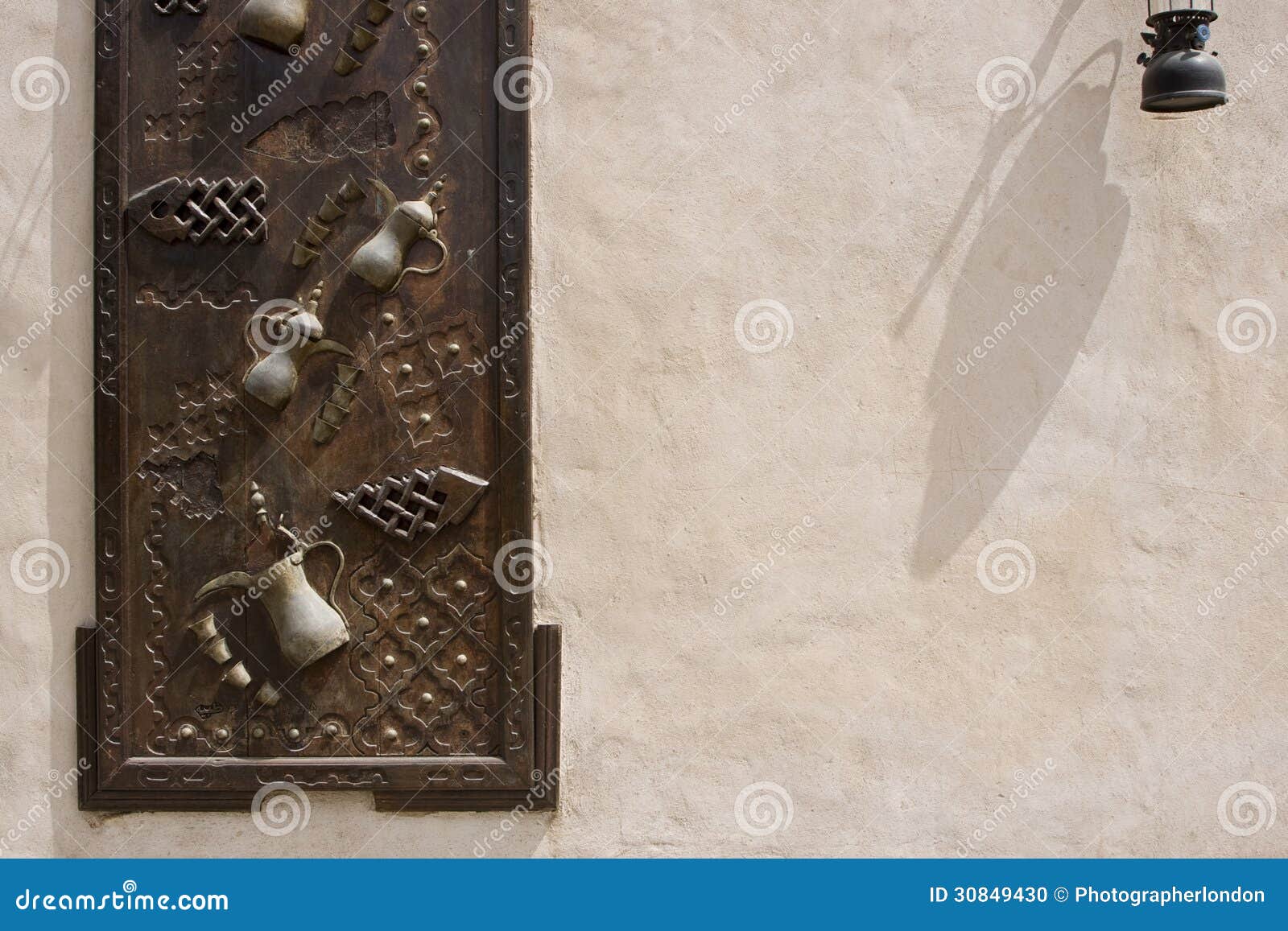 dubai uae ornately decorated wood doors at heritage village in bur dubai