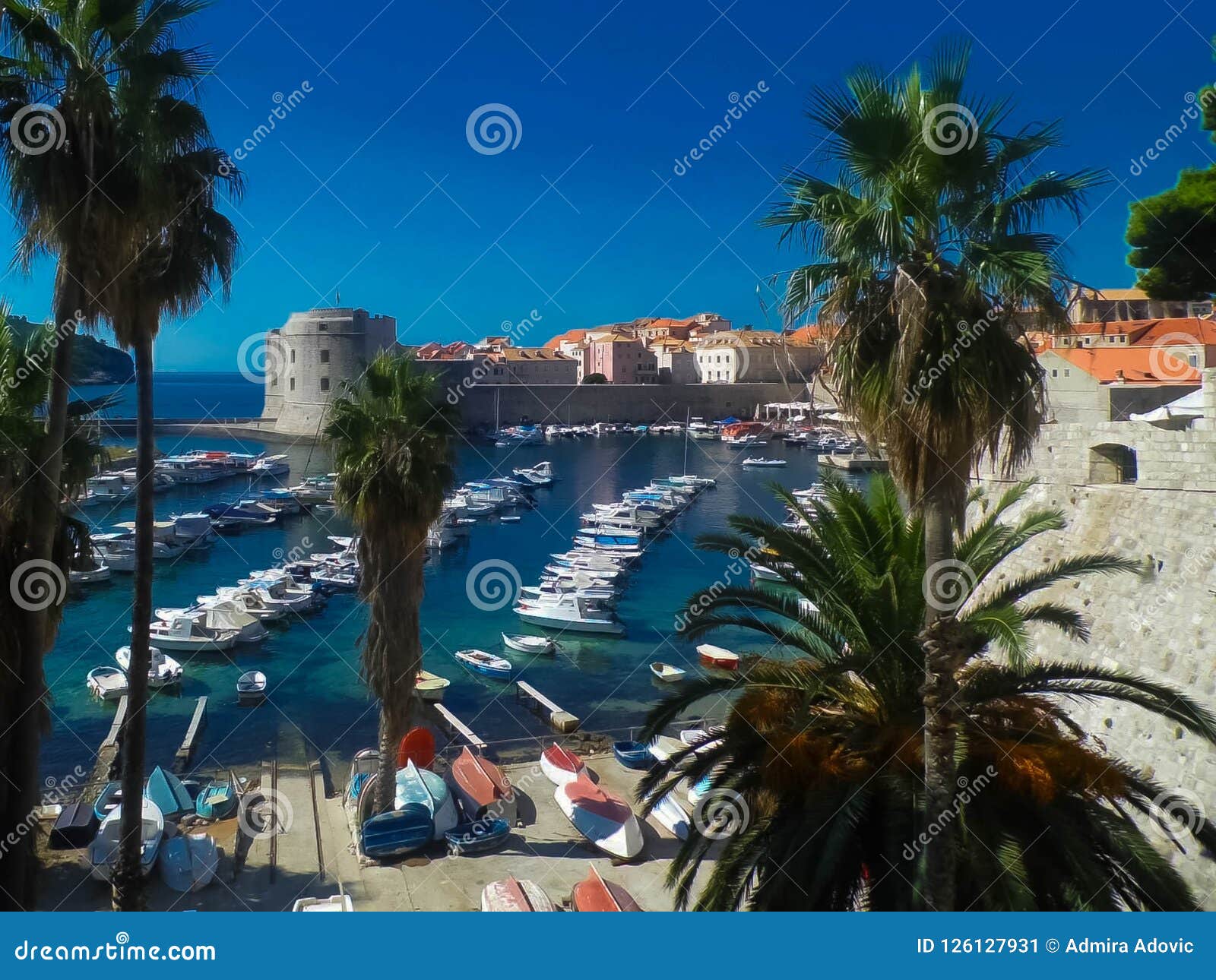 Beautiful Dubrovnik`s Old Town harbor filled with boats