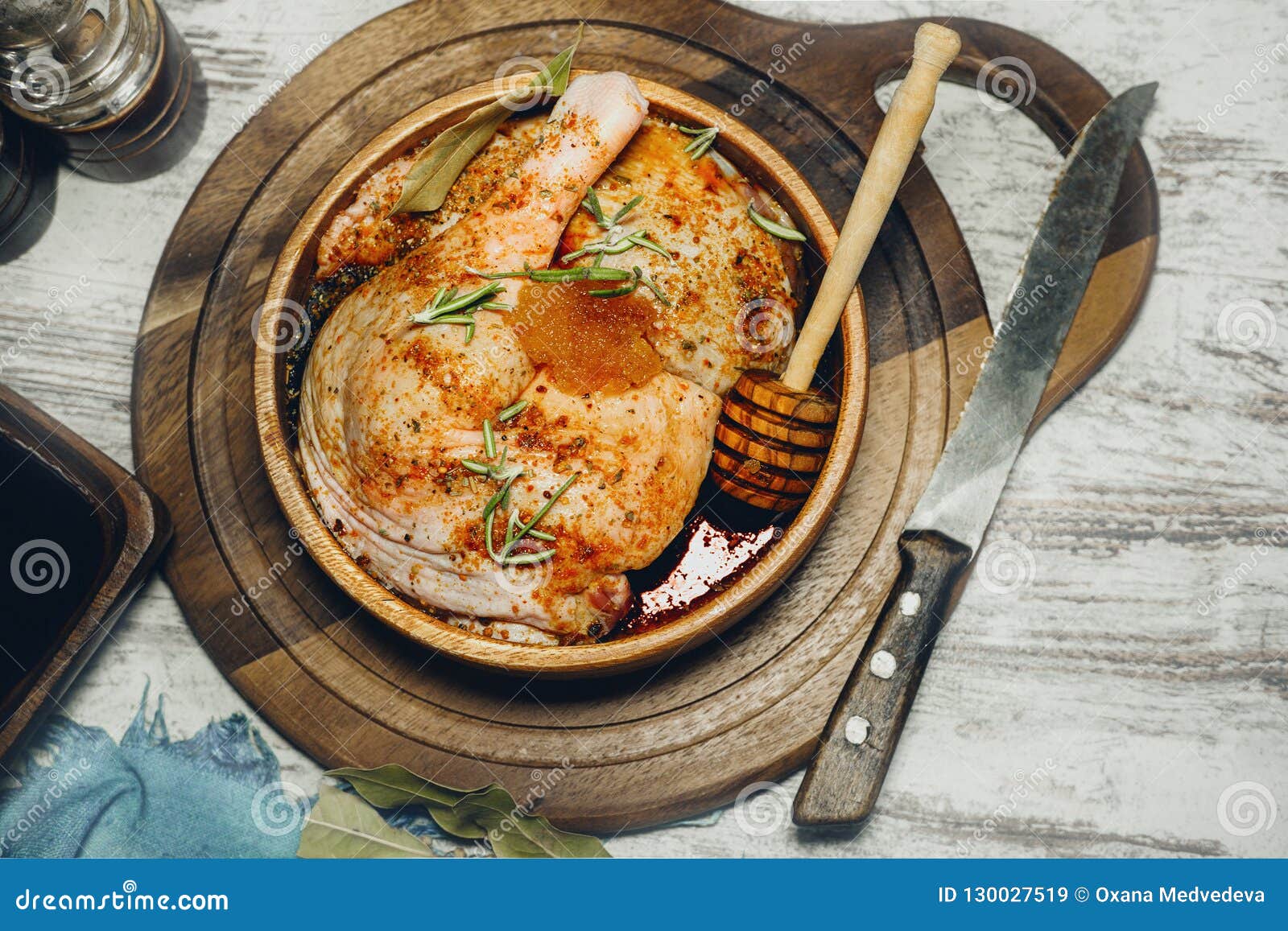 Duck Legs Cooked in a Marinade with Rosemary in the Bowl of an Olive