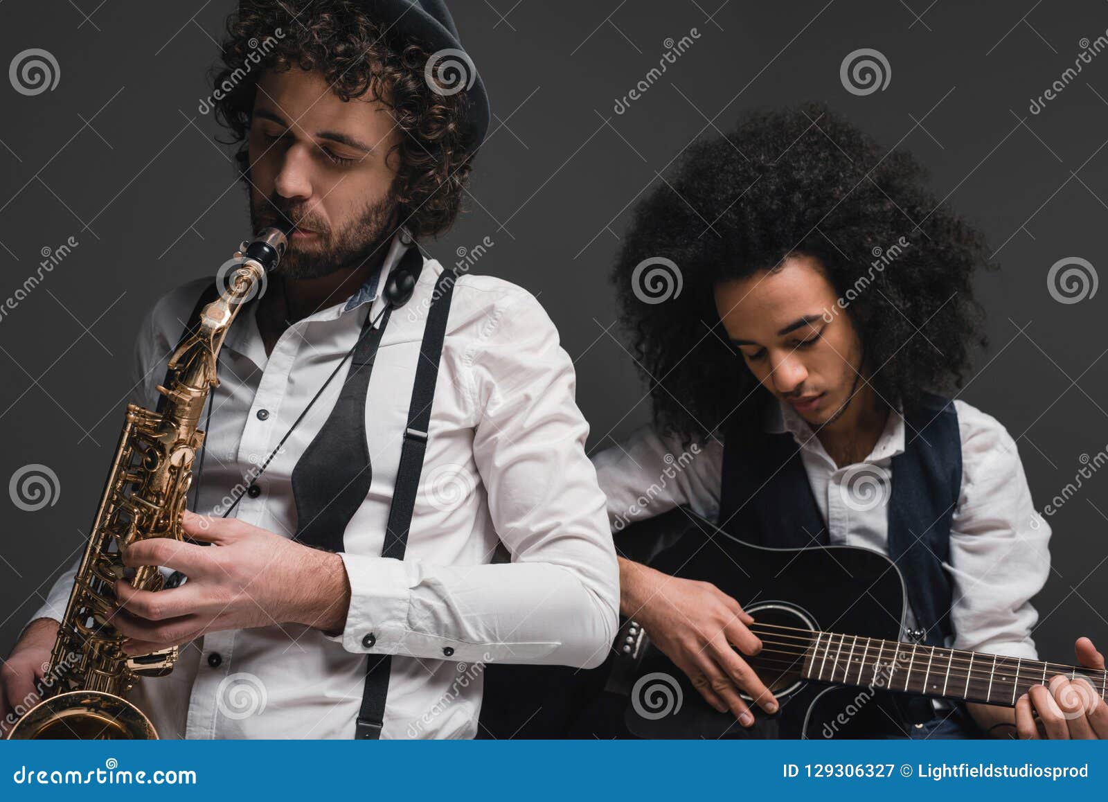 Duet of Musicians Playing Sax and Guitar Stock Image Image of curly