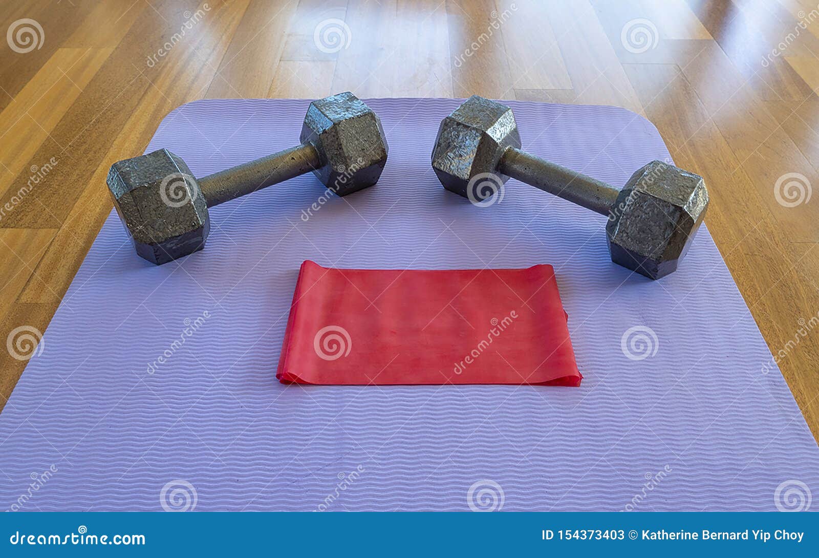 Dumbbells and Exercise Band on a Yoga Mat for a Home Workout Stock Image -  Image of intensity, isolated: 154373403