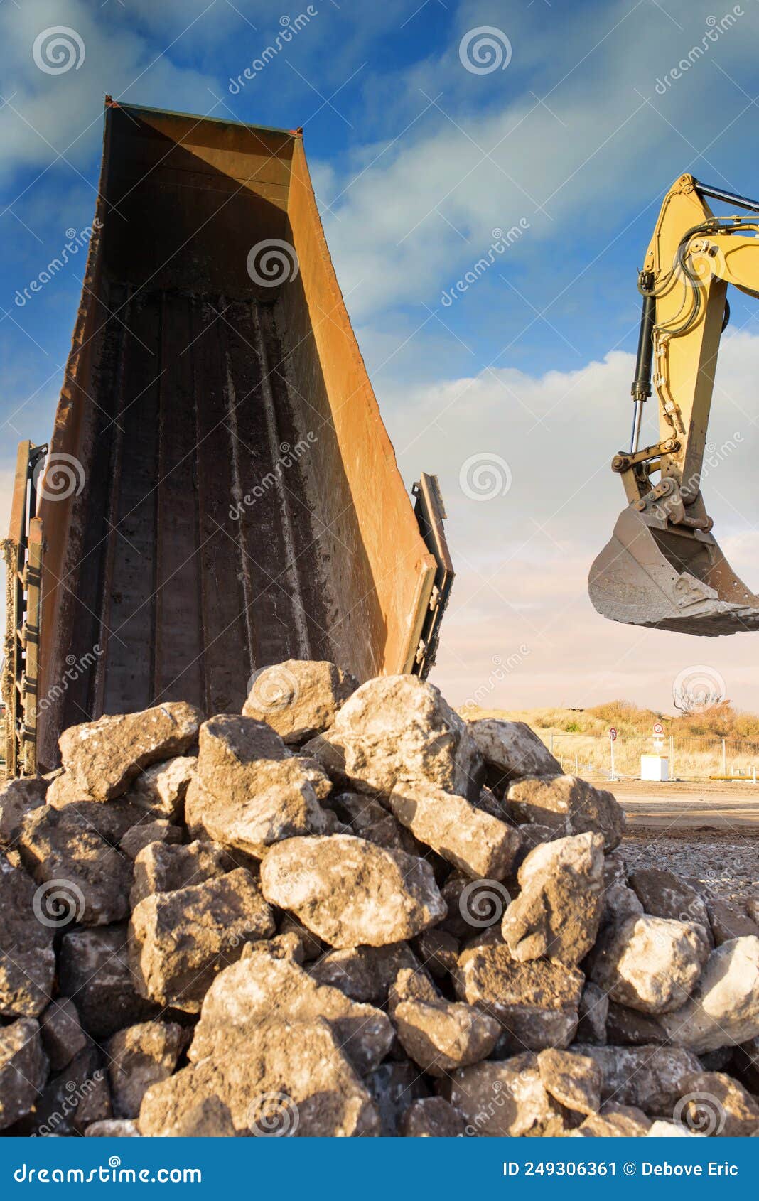 Dump Truck Unloading Its Cargo on a Construction Site Stock Image Image of hydraulics, soil