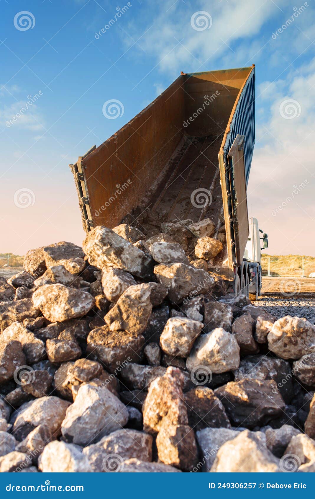 Dump Truck Unloading Its Cargo on a Construction Site Stock Image Image of wheel, aviation