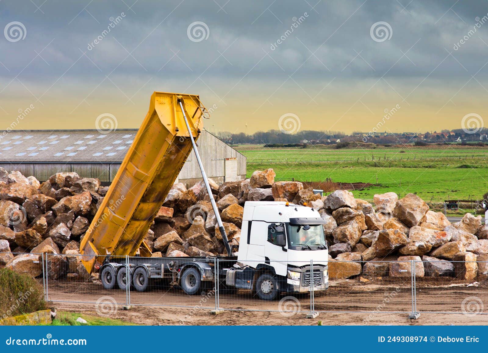Dump Truck Unloading Its Cargo on a Construction Site Editorial Stock Image Image of unloading