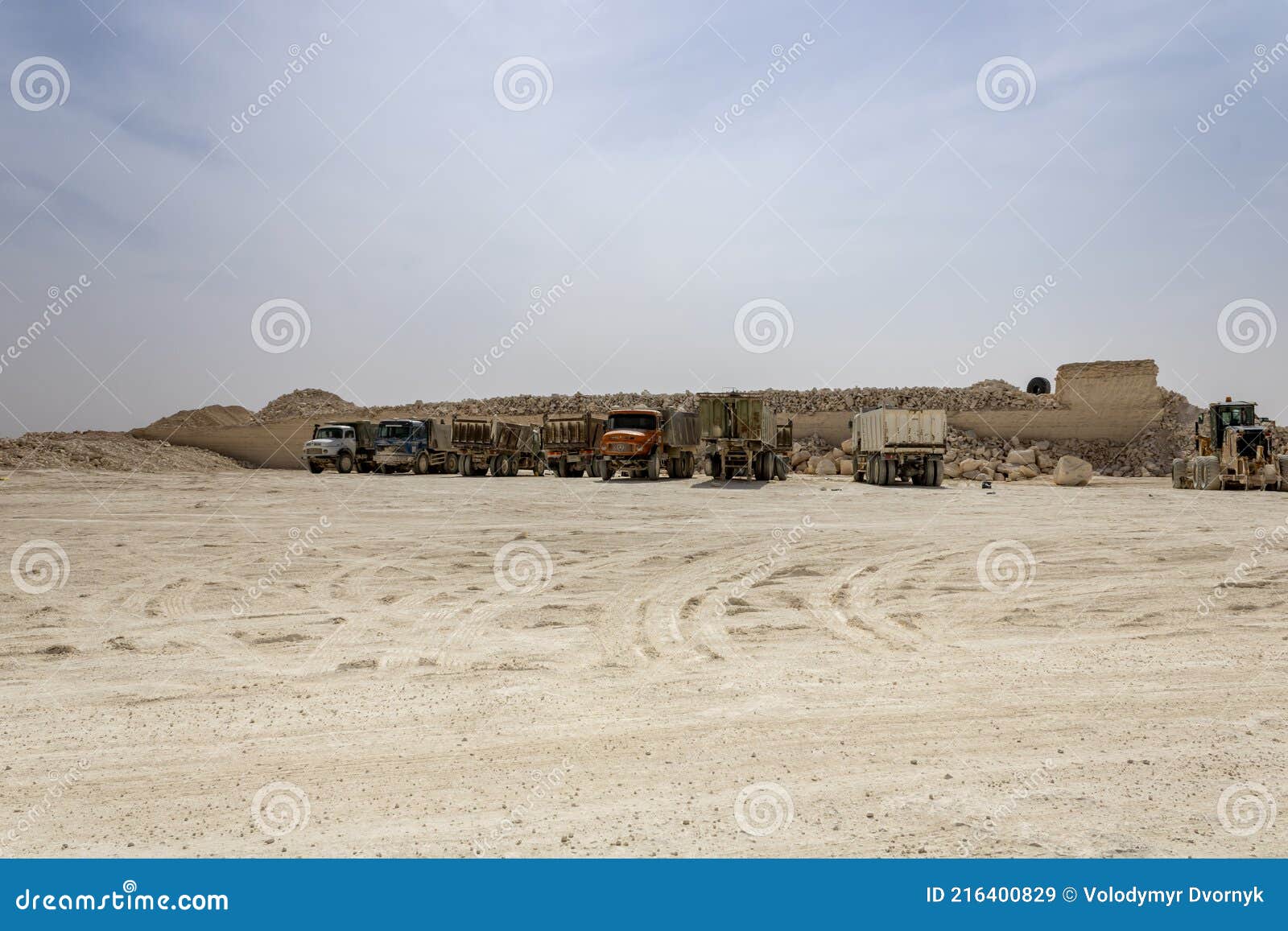 dump trucks on al qiddiya project construction site.