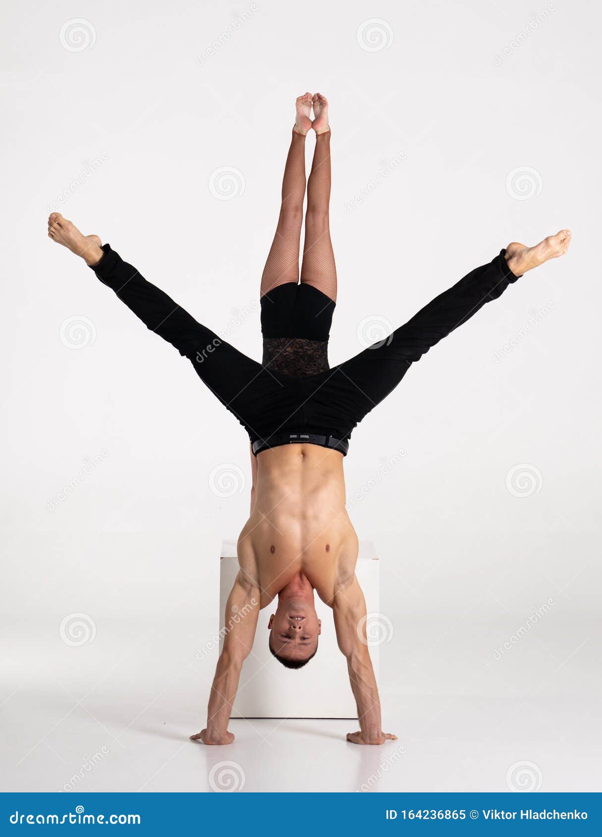 Premium Photo  Duo of male and female acrobats showing hand to hand trick,  isolated on white