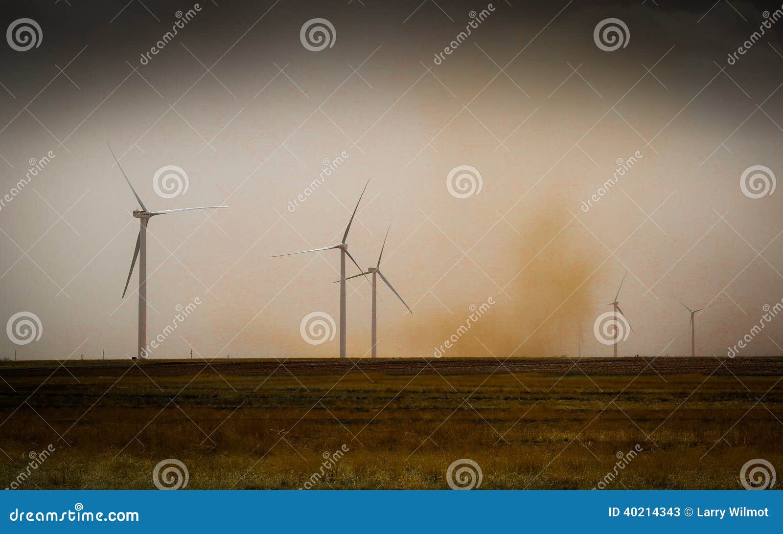 dust storm passes by wind turbines