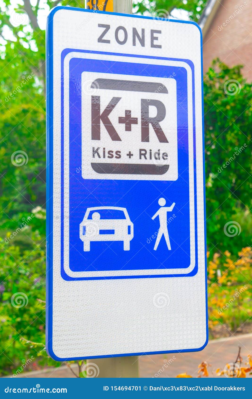 Dutch road sign kiss and ride. Dutch road sign: kiss and ride zone, you can quickly park the car here to drop off or pick up someone