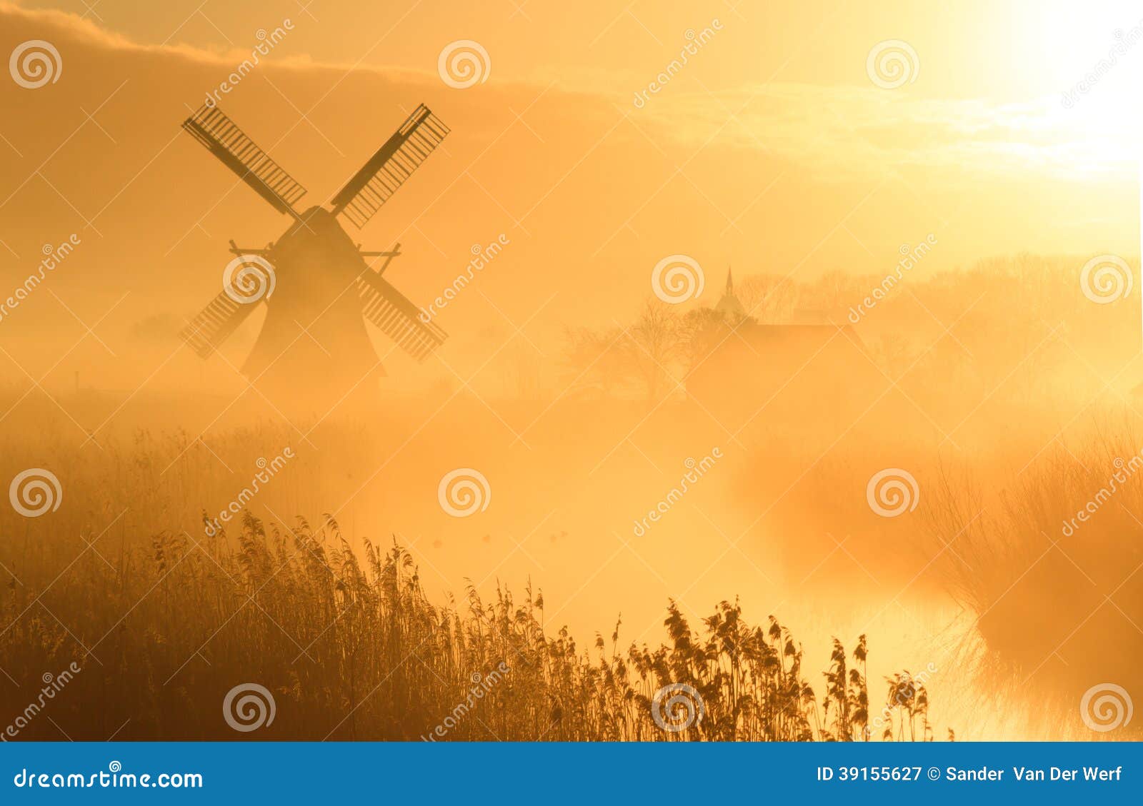 Dutch sunrise. Windmill during a foggy sunrise in the Dutch countryside.