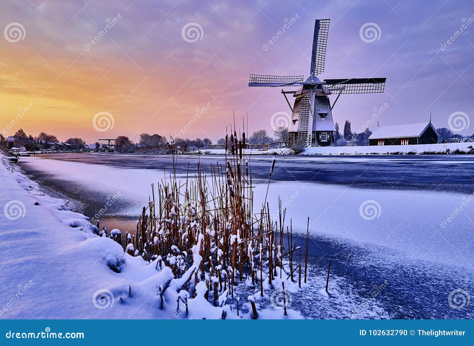 dutch windmill in the snow of a holland winter