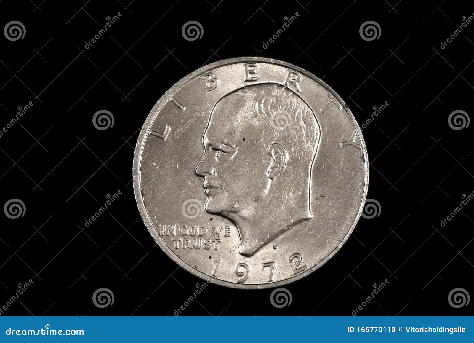 a dwight eisenhower american one dollar coin  on black