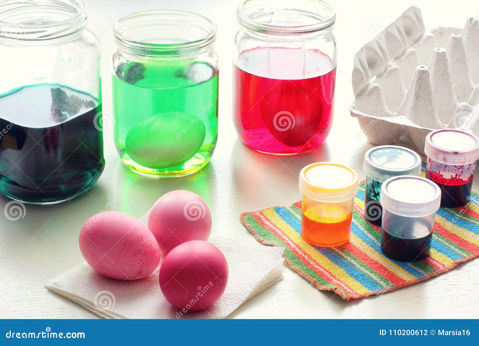Dyeing Easter Eggs stock photo. Image of pastel, concentrated 110200612