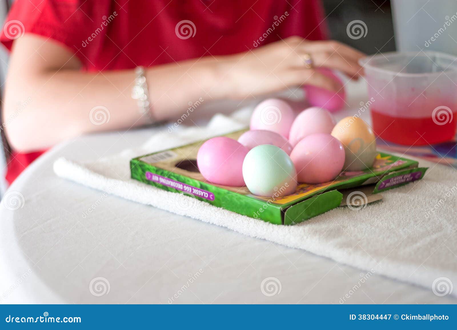 Dying Easter Eggs stock image. Image of holiday, table 38304447
