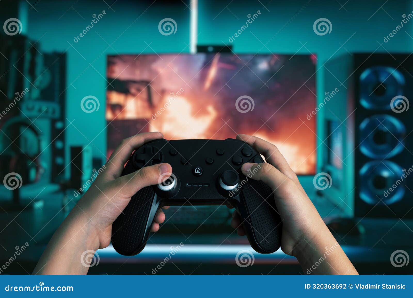 dynamic image of hands holding a gamepad in front of a modern gaming computer
